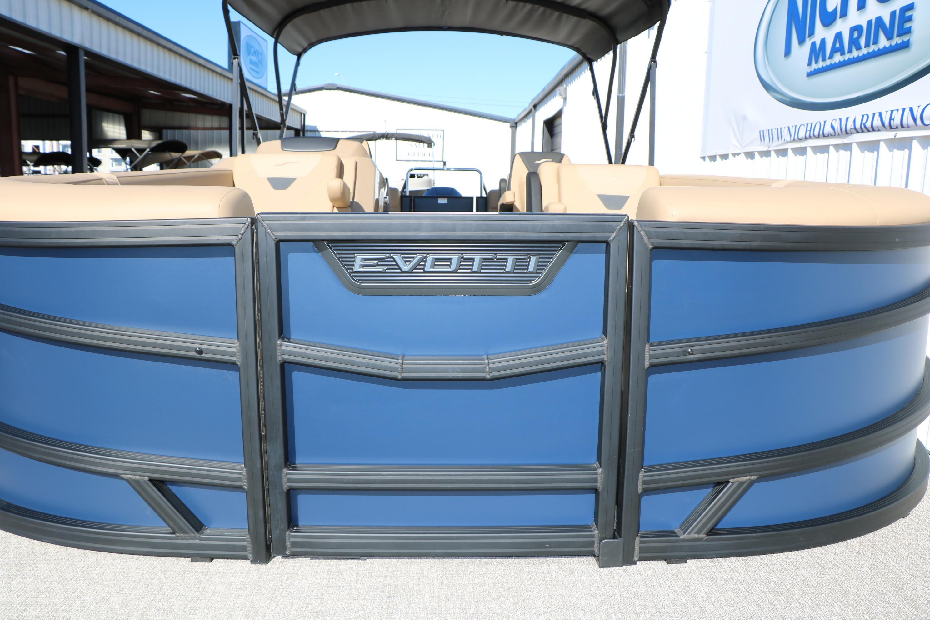 2026 Evotti 525 QL Tri-Toon boat with blue exterior and beige seating.