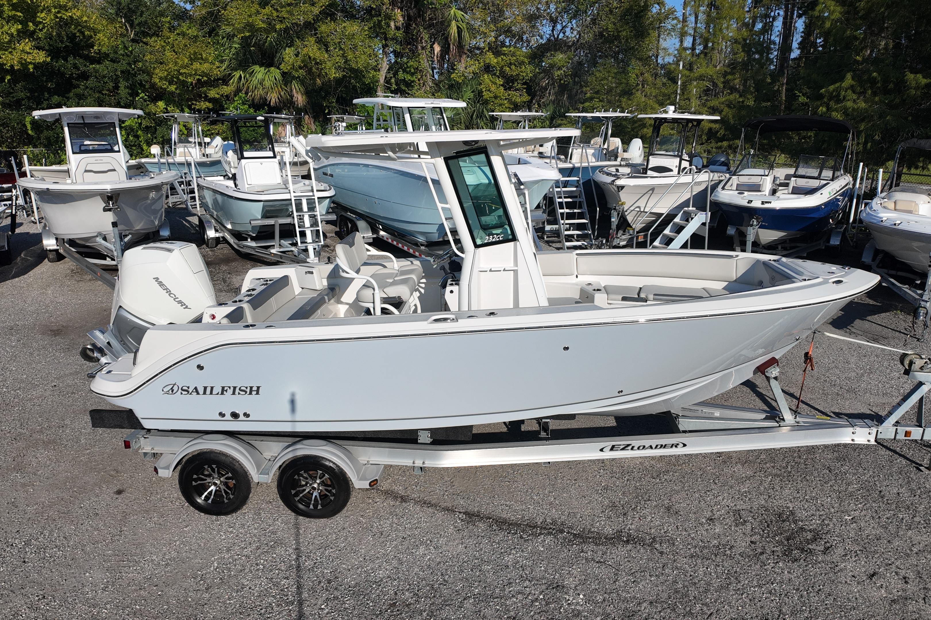 2026 Sailfish 232 CC boat on trailer, surrounded by other boats in a lot.