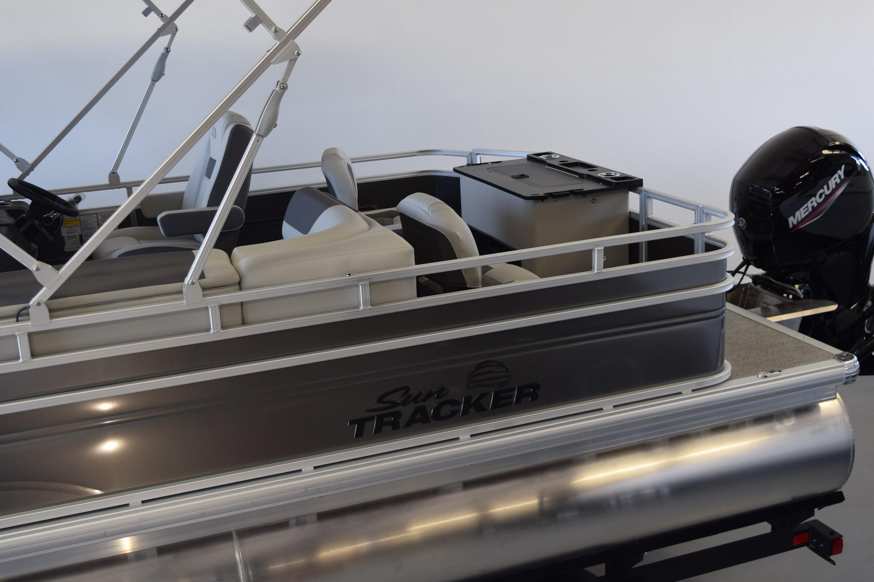 2026 Sun Tracker Fishin' Barge 22 DLX pontoon boat with Mercury outboard motor.