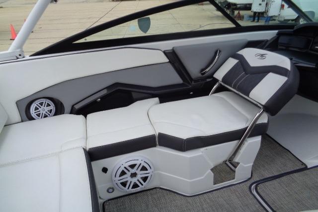 2019 Monterey 218SS Super Sport boat interior with white and black seating, featuring built-in speakers.