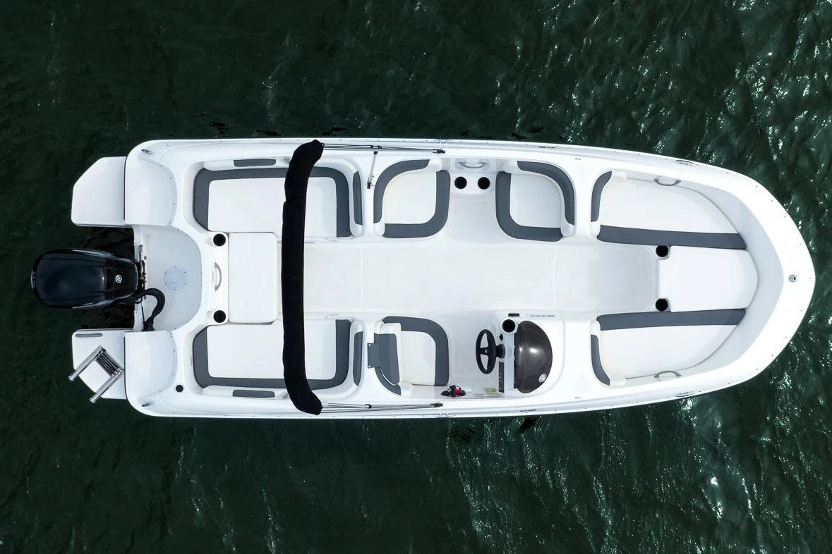 Manufacturer Provided Image: 2025 Bayliner Element E18 boat, aerial view, white and gray seating, on water.