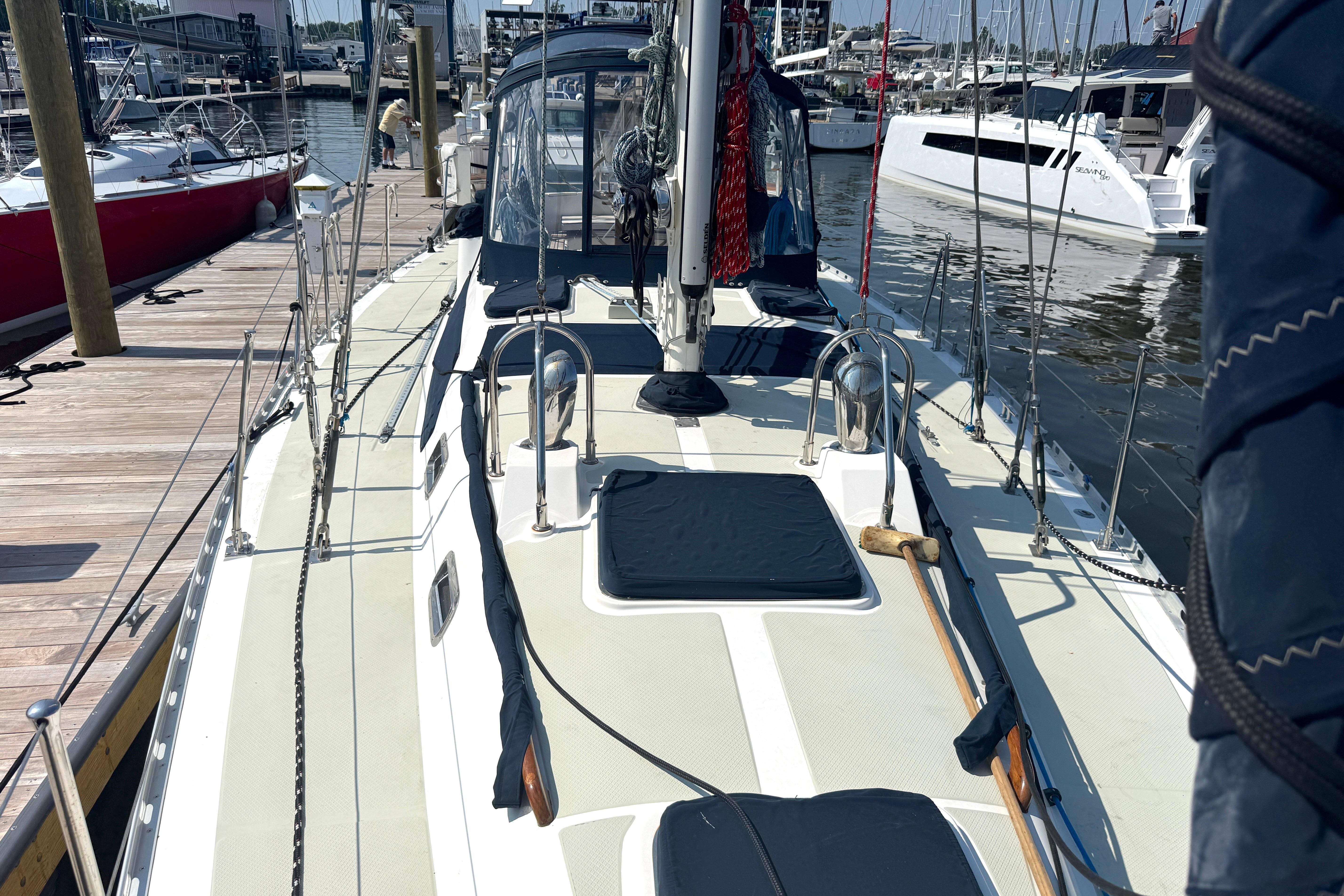 Sailboat docked at marina, Hylas 46 model, 2002, with visible deck and rigging.