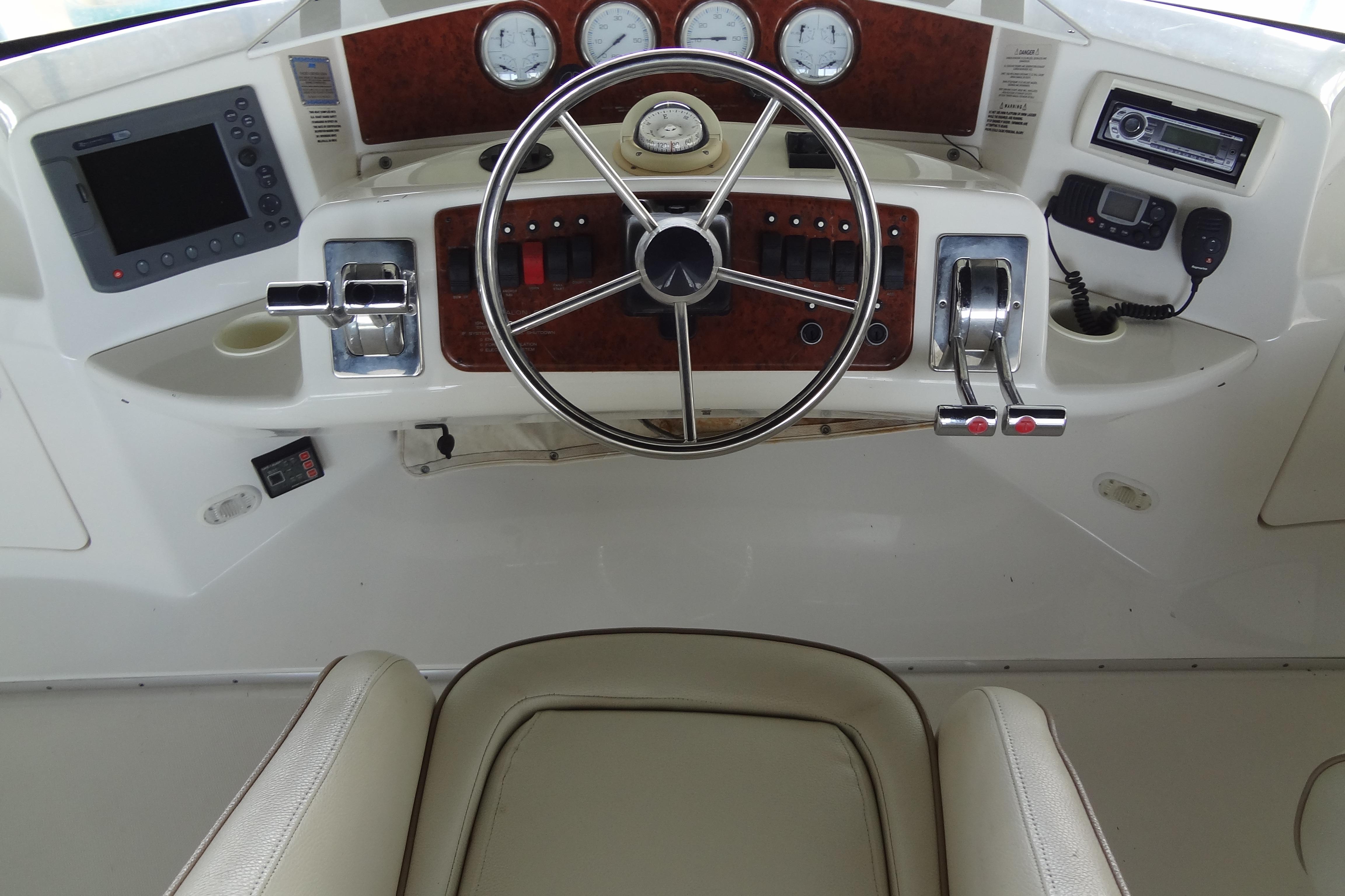 Helm of 2005 Silverton 34 Convertible with steering wheel and control panel.