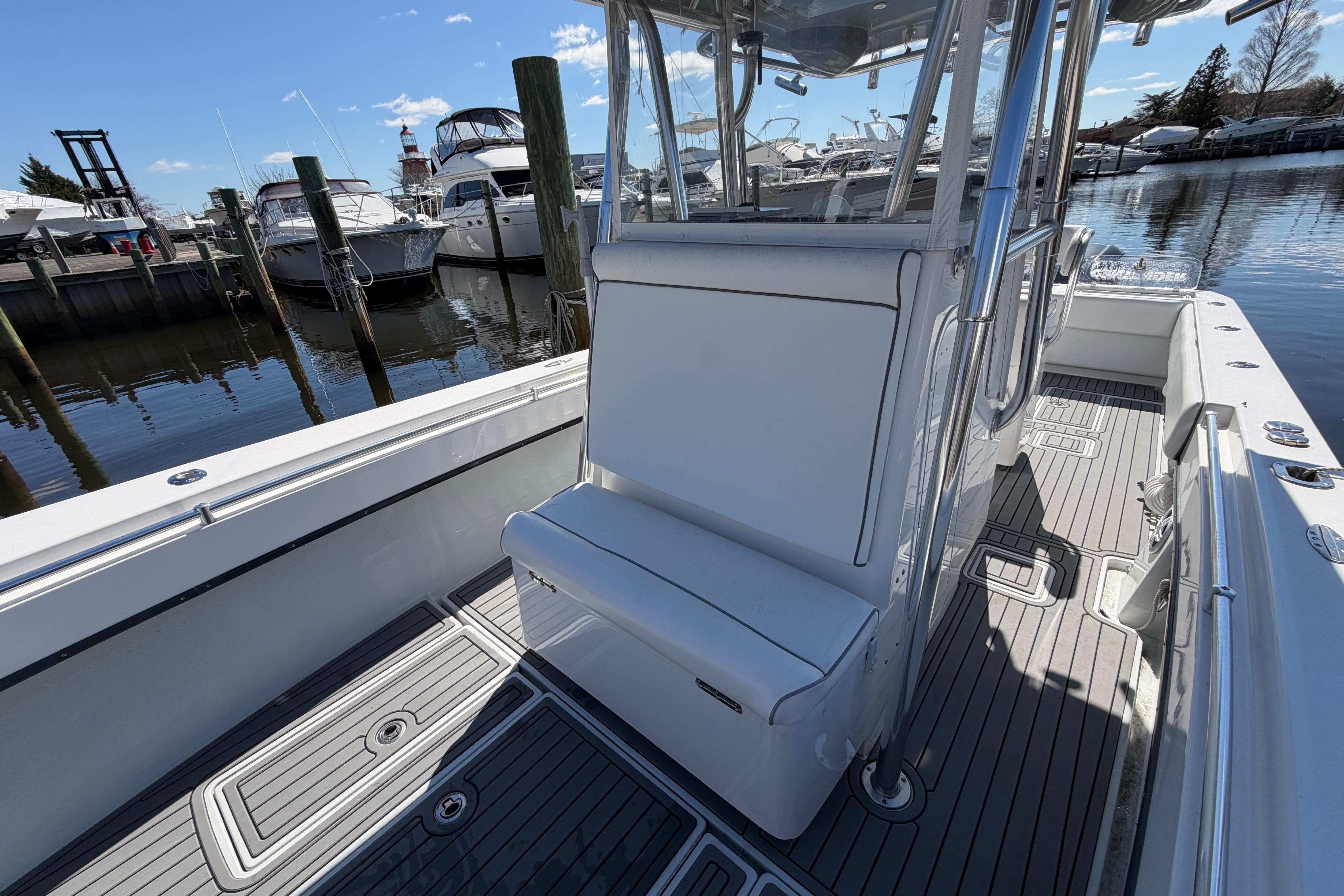 2015 Contender 32 ST boat interior with seating, docked at marina.