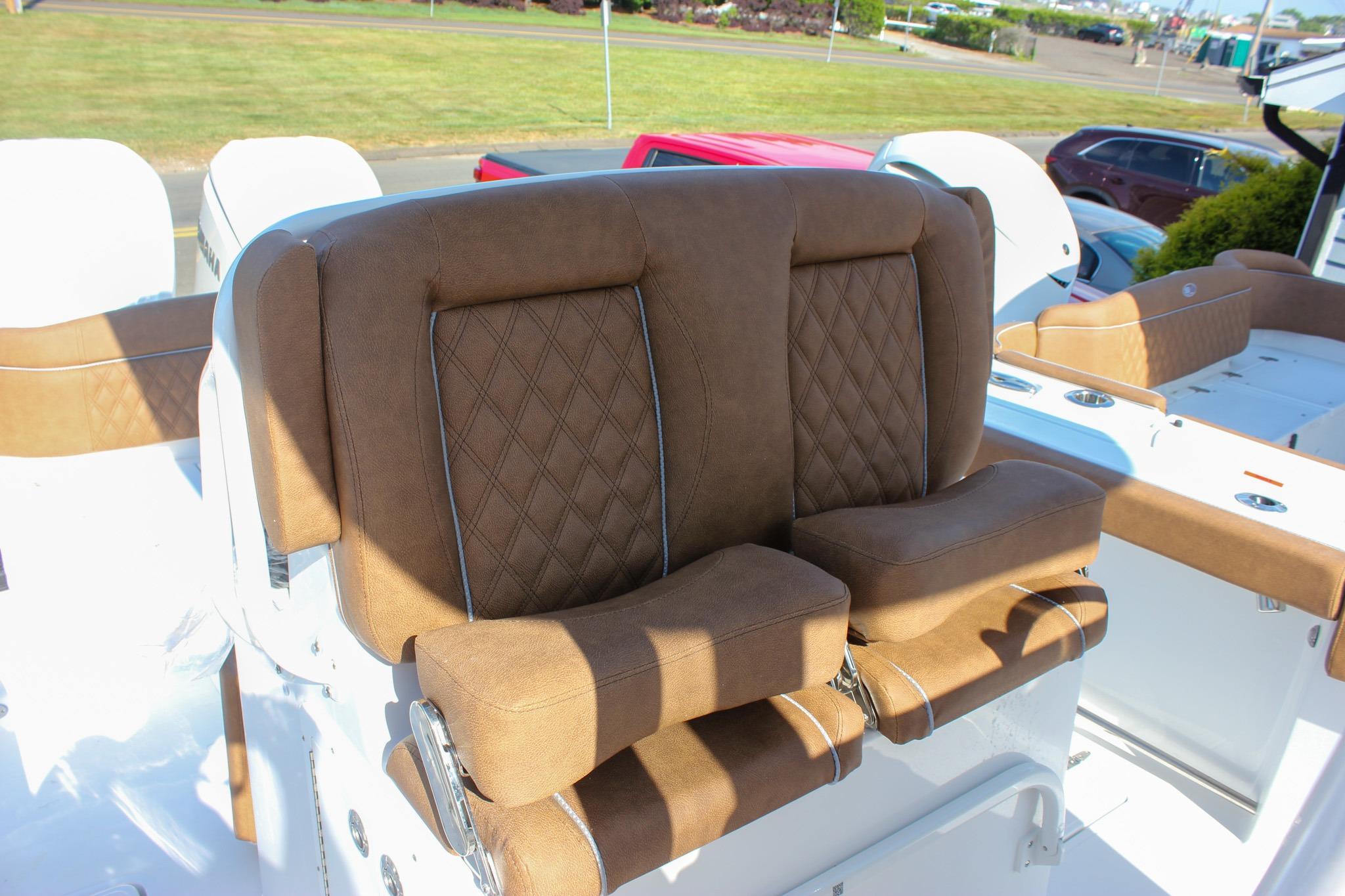 Luxurious brown seating on 2027 Sea Hunt Ultra 275 SE boat, featuring diamond stitching.