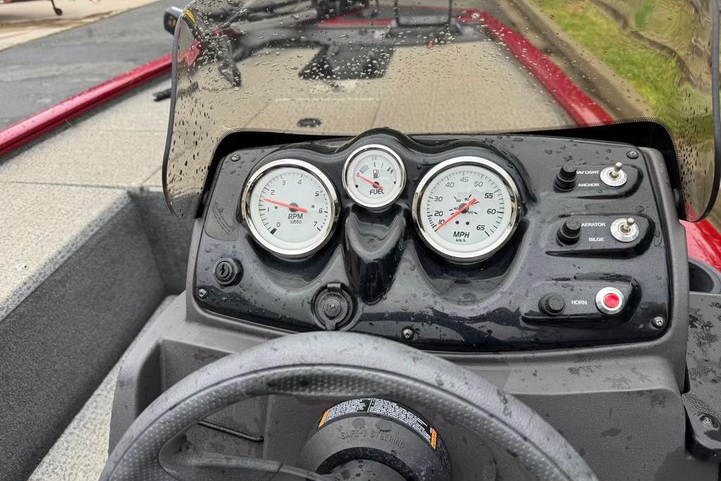 Dashboard of a 2022 Tracker Pro 170 boat with gauges and controls.