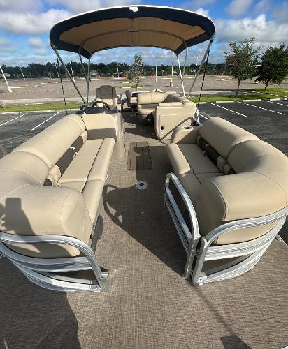 2023 Sun Tracker SportFish 22 XP3 pontoon boat with spacious seating.