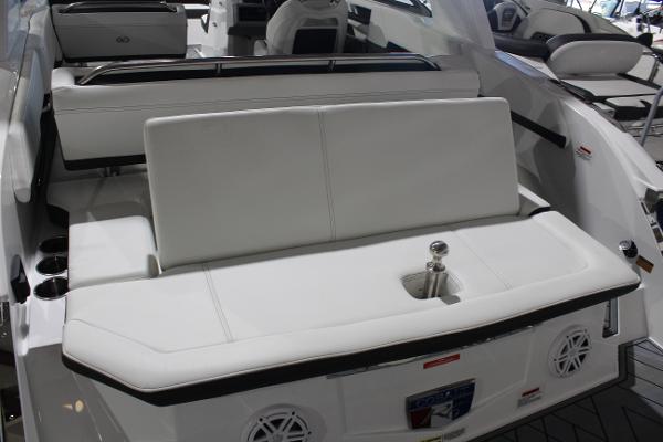 2025 Cobalt R6 boat interior with white seating and cup holders.