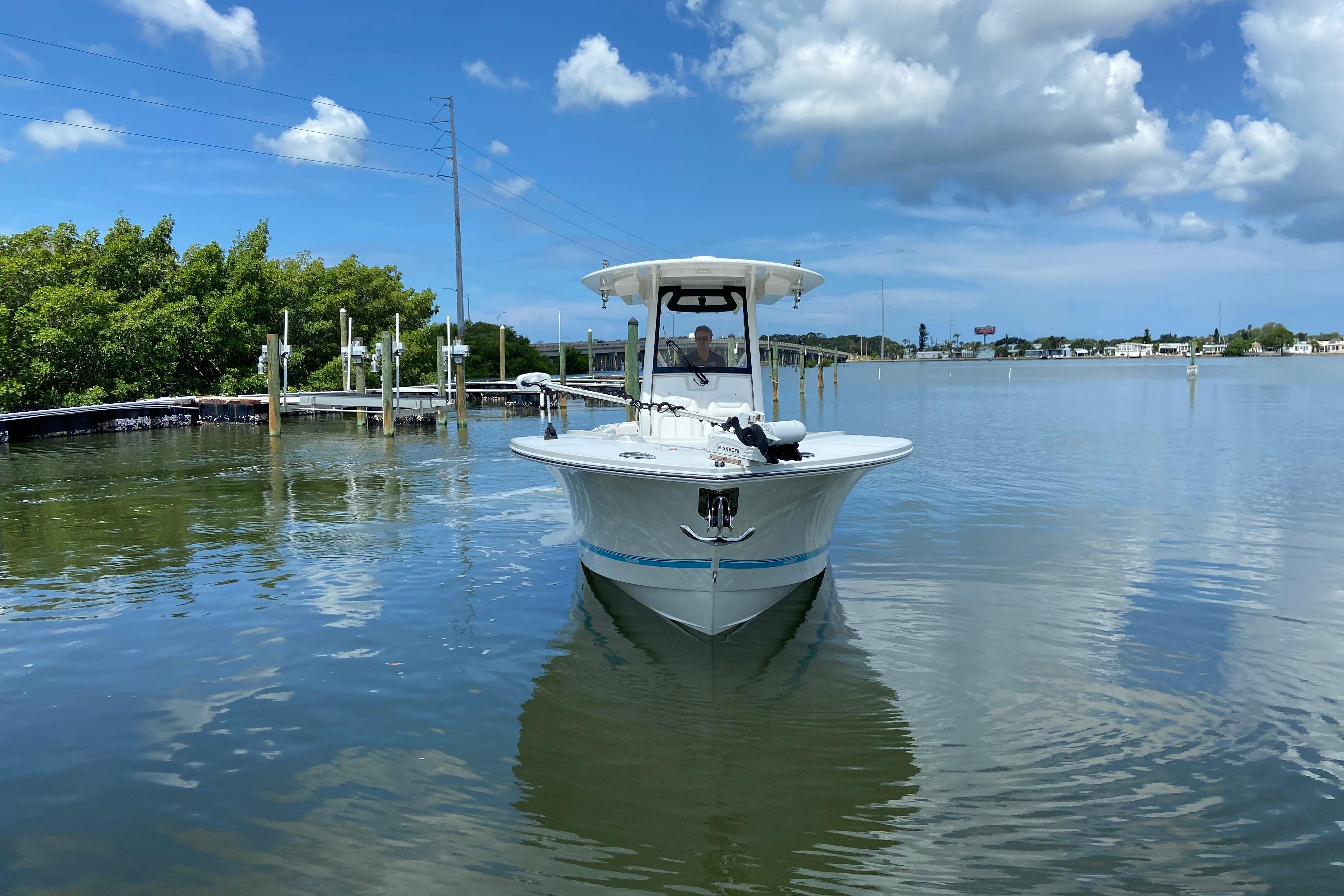 2021 Regulator 28 boat on calm water under a partly cloudy sky.