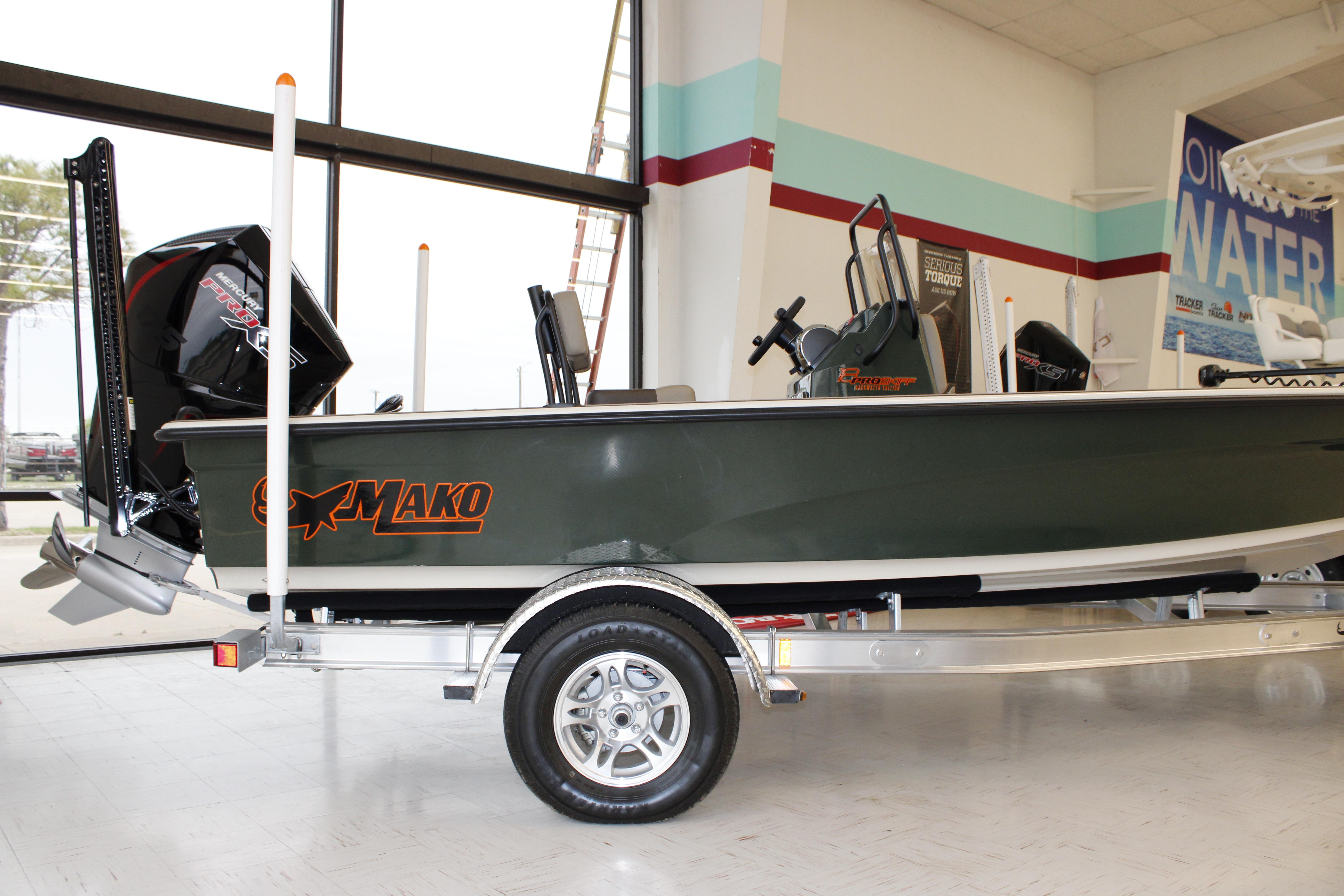 2026 Mako 18 Pro Skiff Backwater Edition boat on display in showroom.