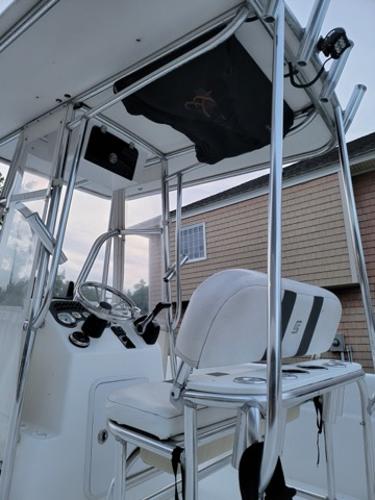 2011 Carolina Skiff 258 DLV boat interior with steering console and seating.