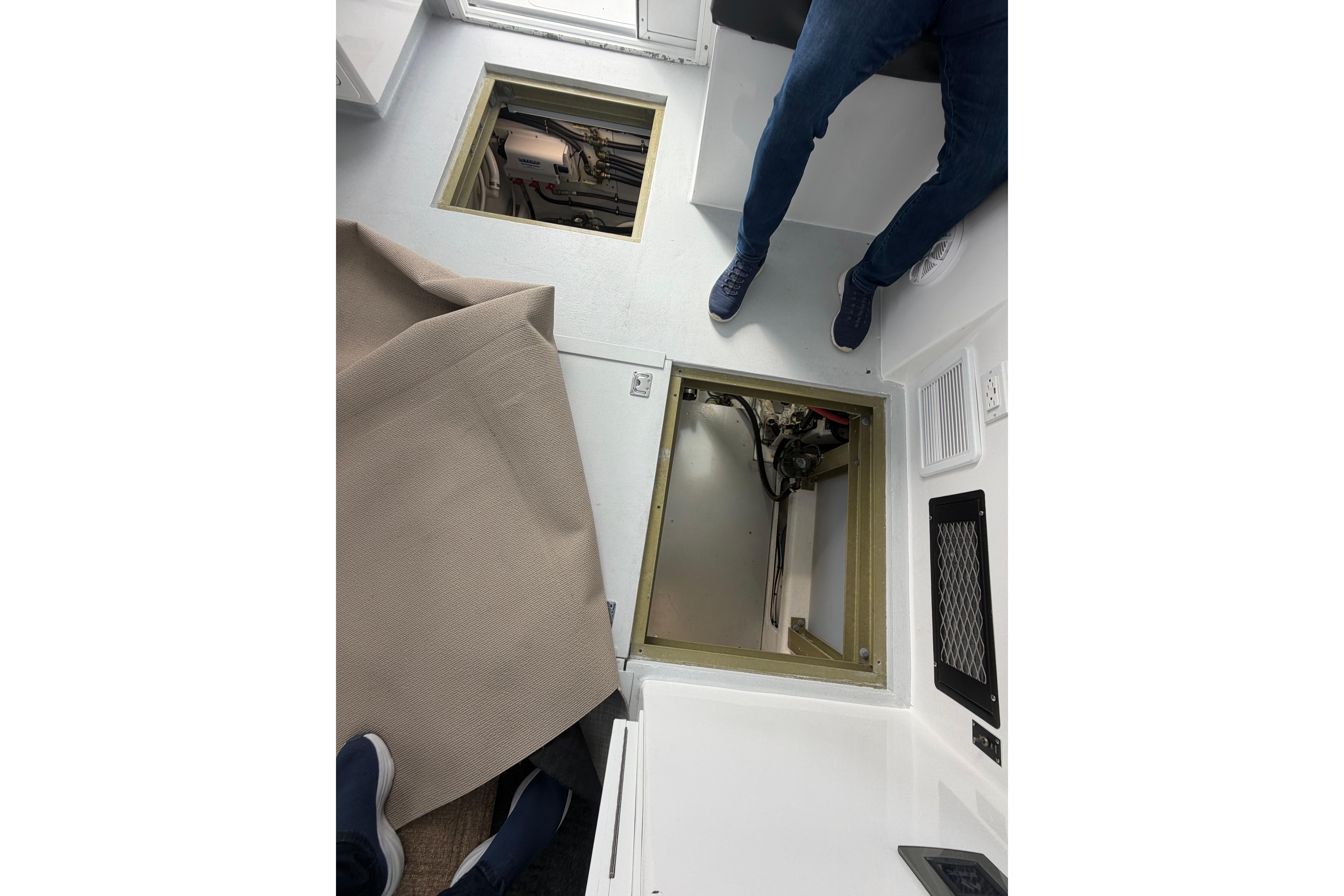 2018 H&H Marine Osmond Beal interior with open hatch and visible engine compartment.