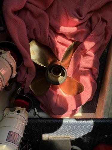 Bronze boat propeller on pink cloth, Ovation 52, 2009 model.