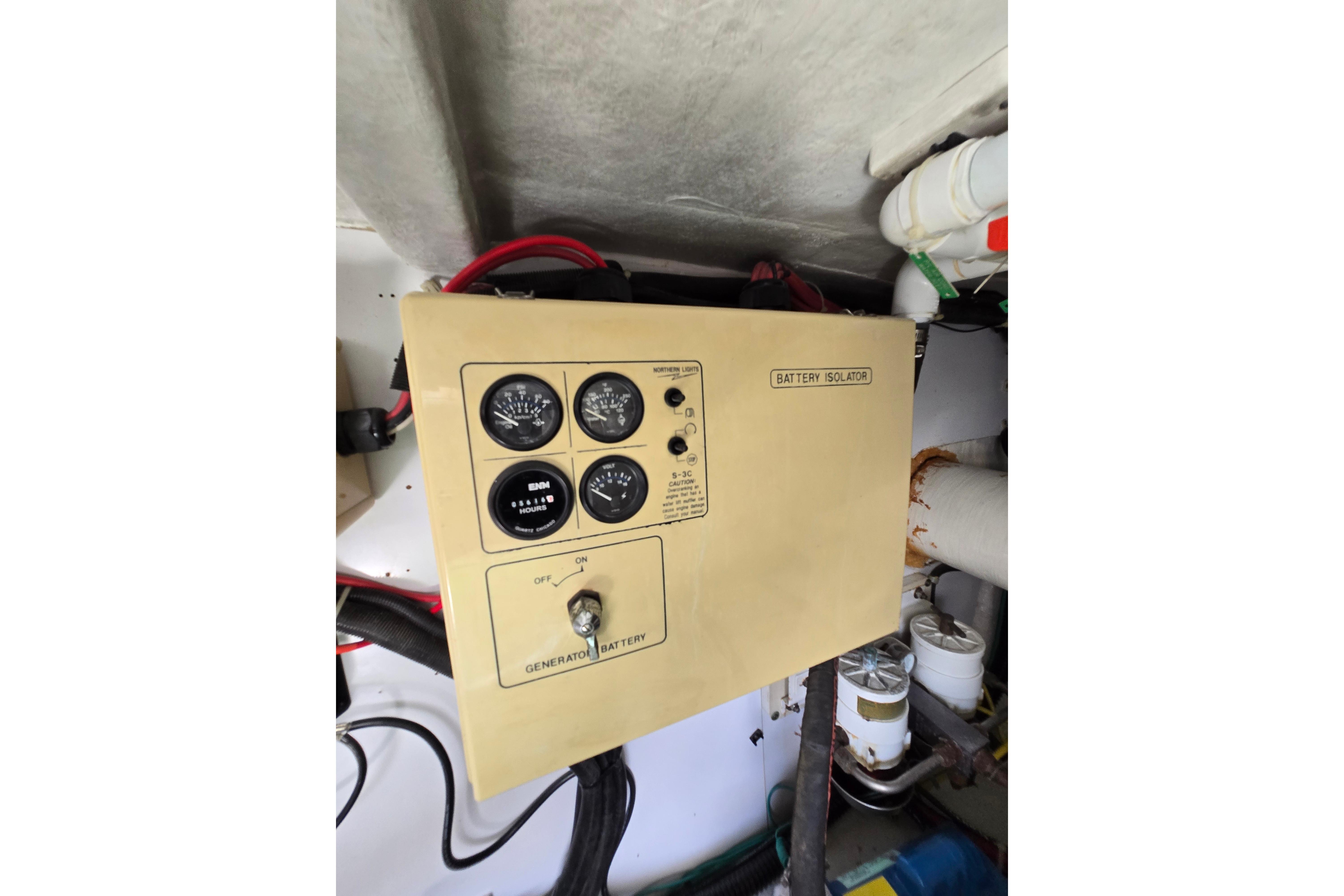 Control panel of a 2004 Grand Harbour 58 yacht, featuring battery isolator and gauges.