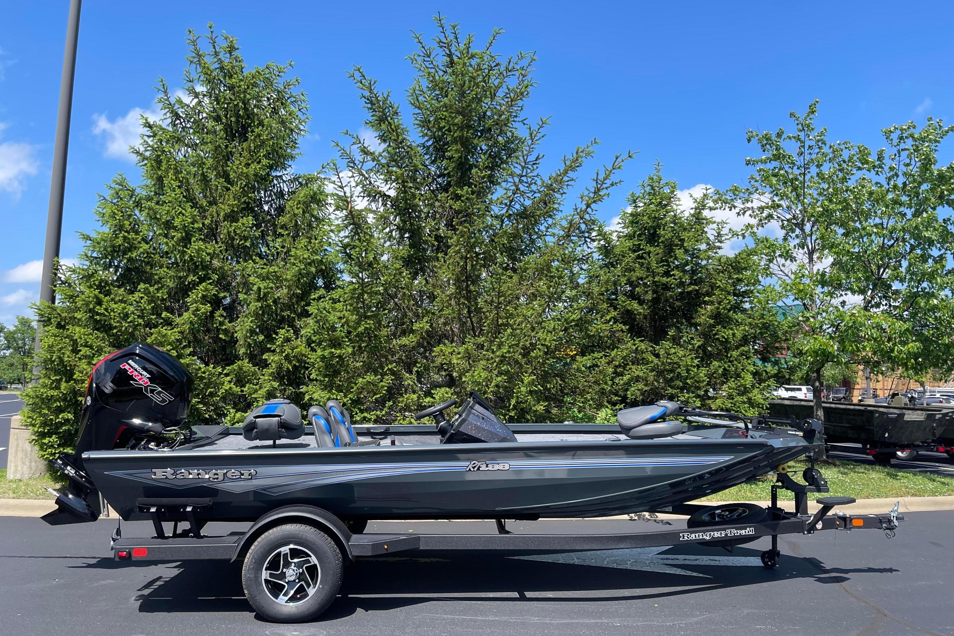 2026 Ranger RT188 boat on trailer, parked outdoors with trees in background.