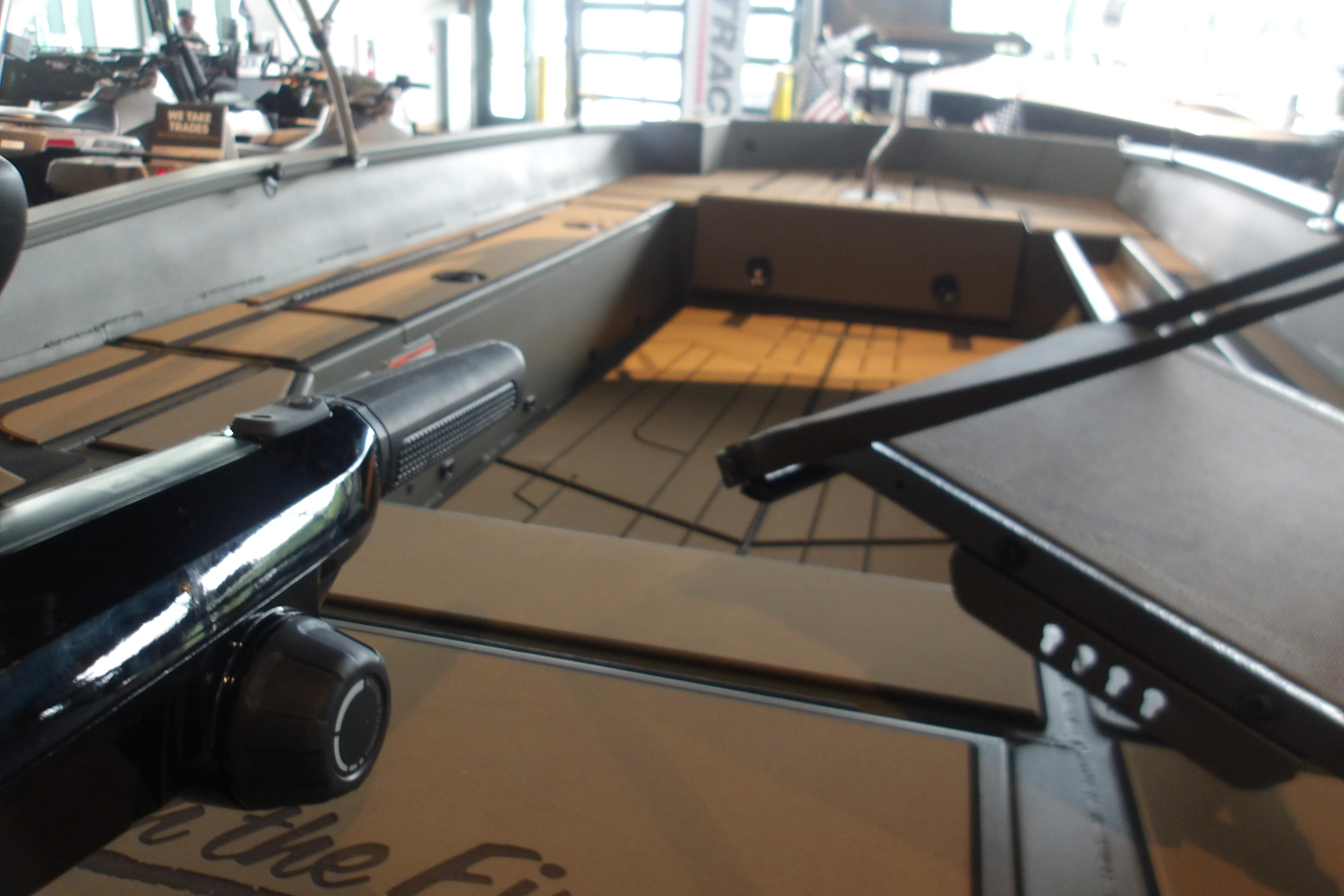 2026 Tracker Grizzly 1756 T Marsh boat interior with seating and controls.