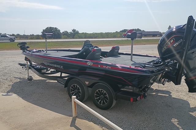 2026 Phoenix 721 ZXL bass boat on trailer, parked outdoors, featuring Yamaha engine.