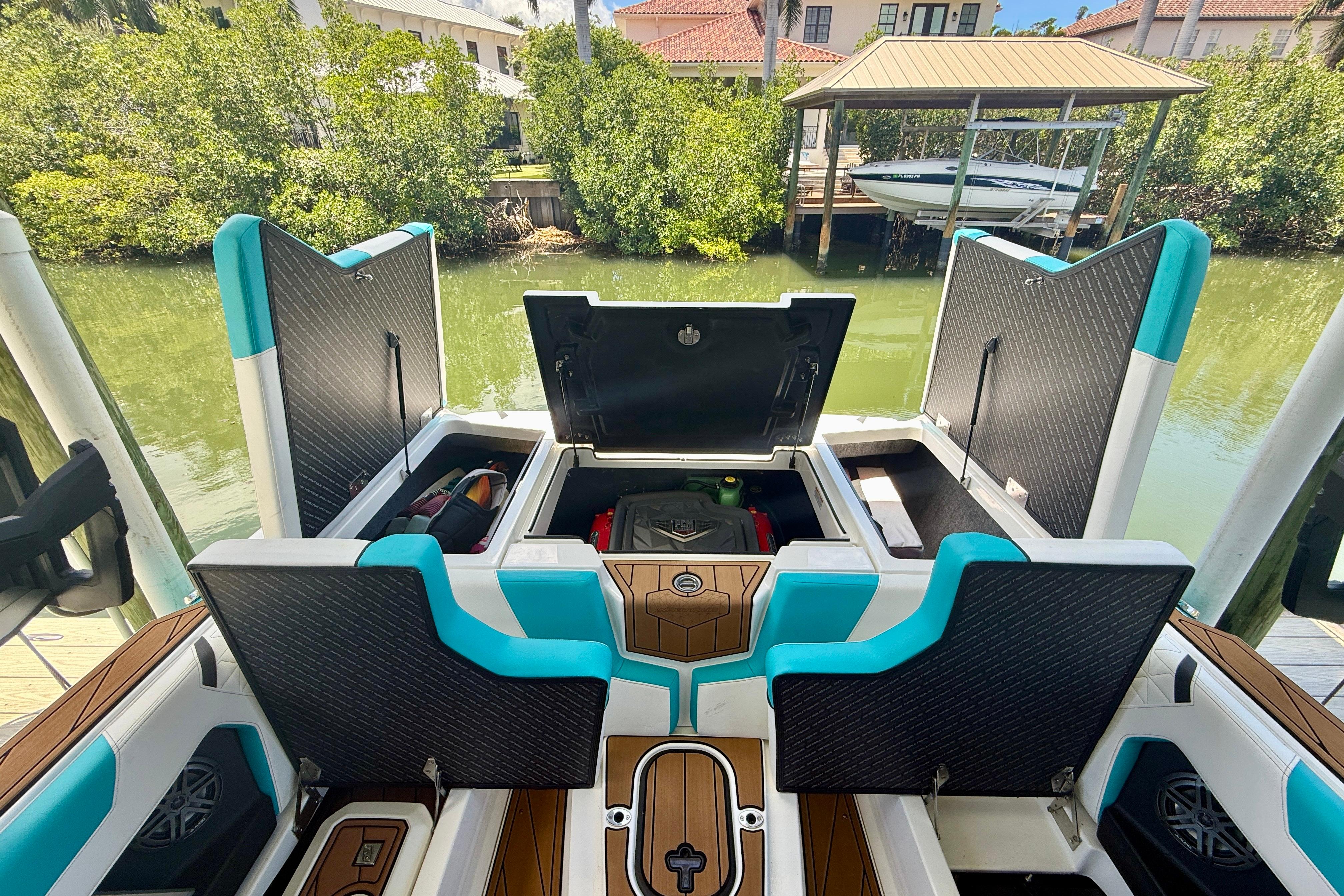 2024 Nautique Super Air Nautique GS20 boat interior with open storage compartments.