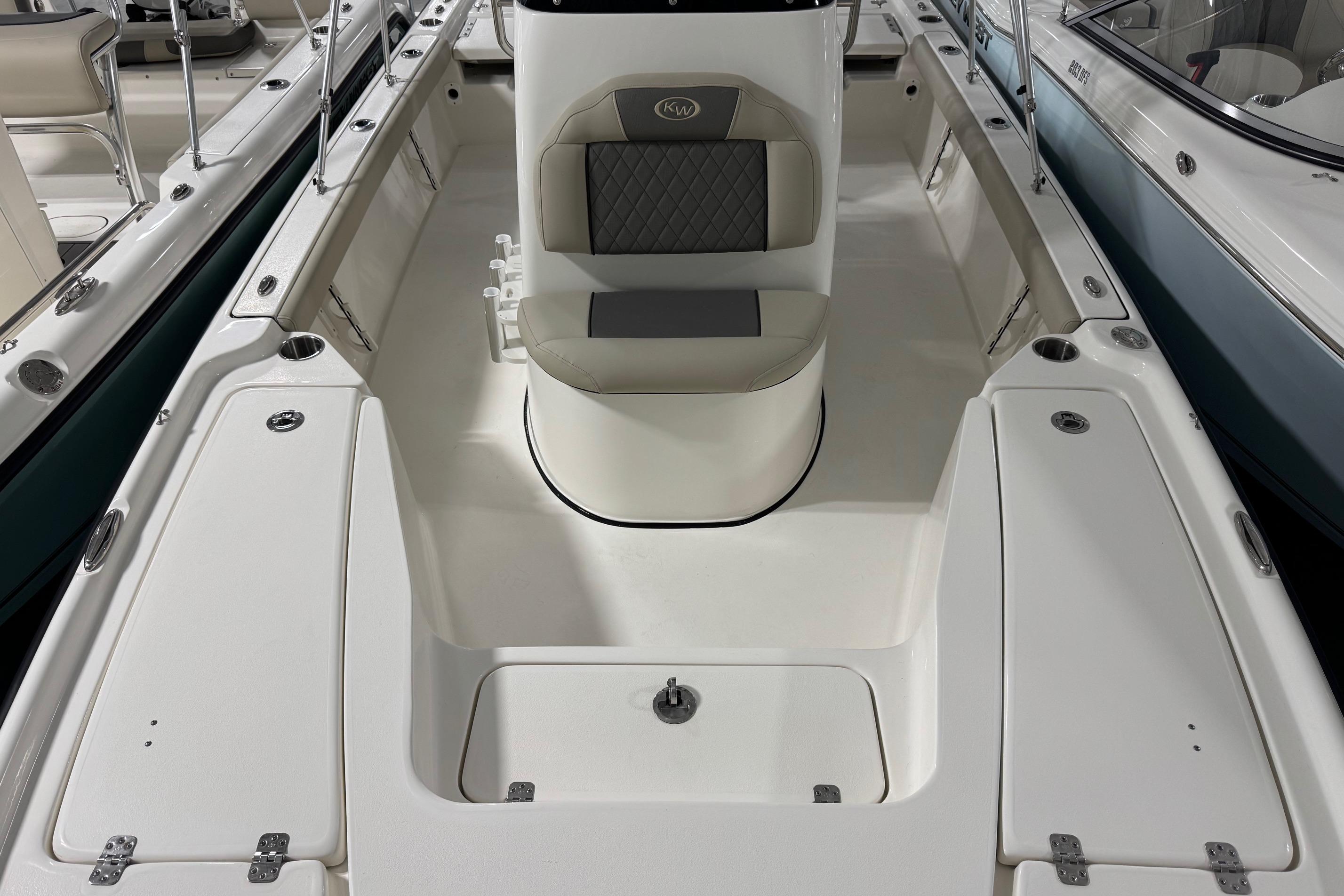 2026 Key West 210 Bay Reef boat interior with seating and storage compartments.