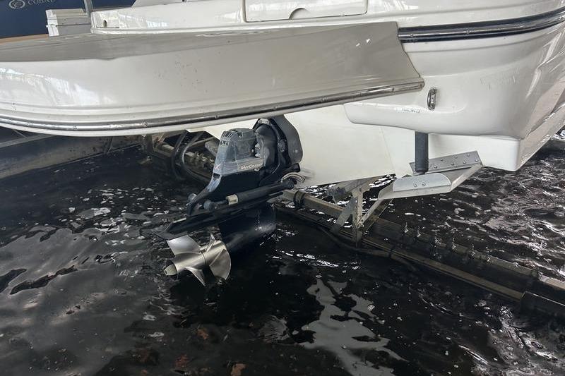 2011 Sea Ray 300 SLX boat stern and propeller in water.