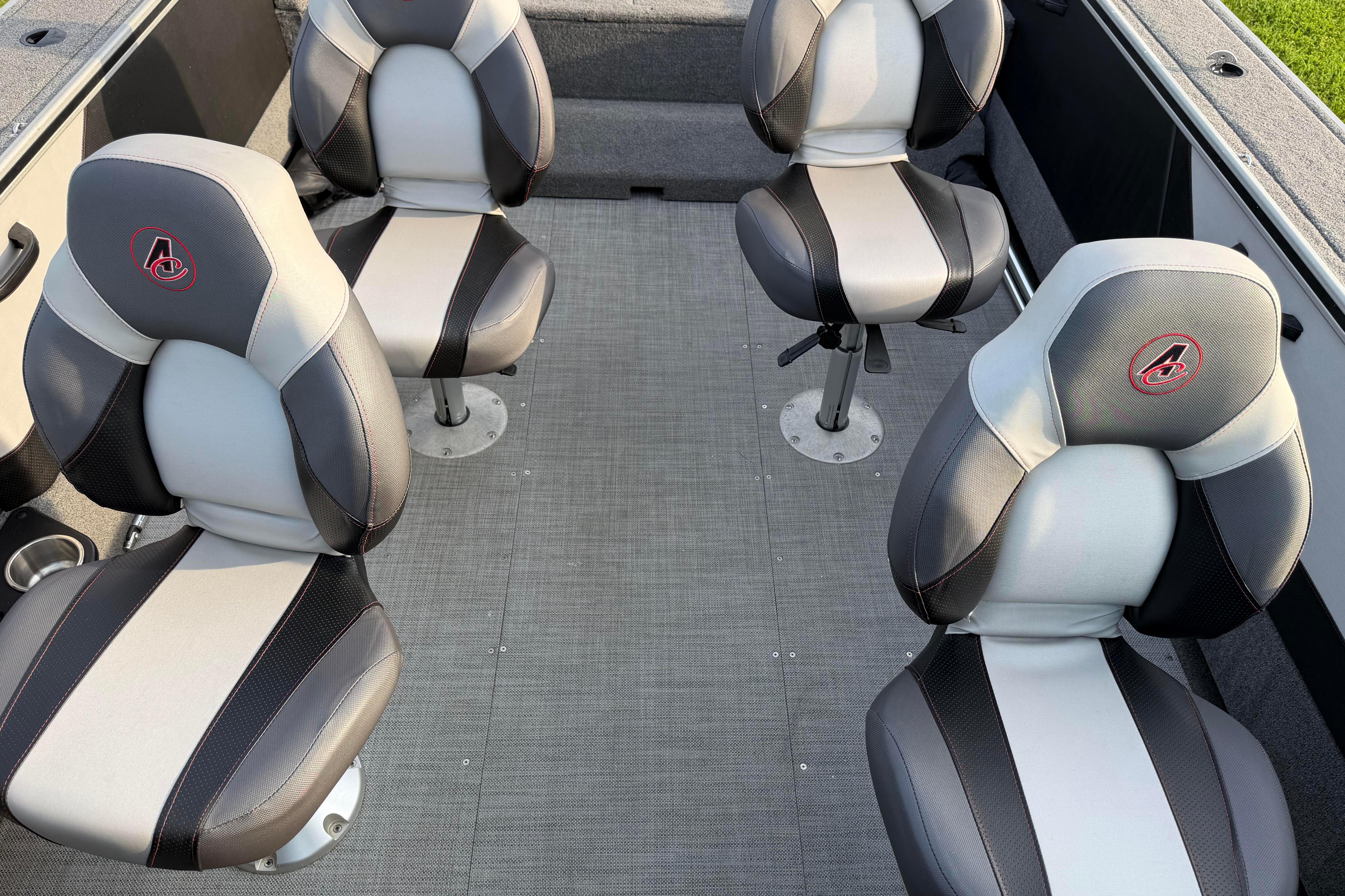 2019 Alumacraft Trophy 205 boat interior with four cushioned seats.
