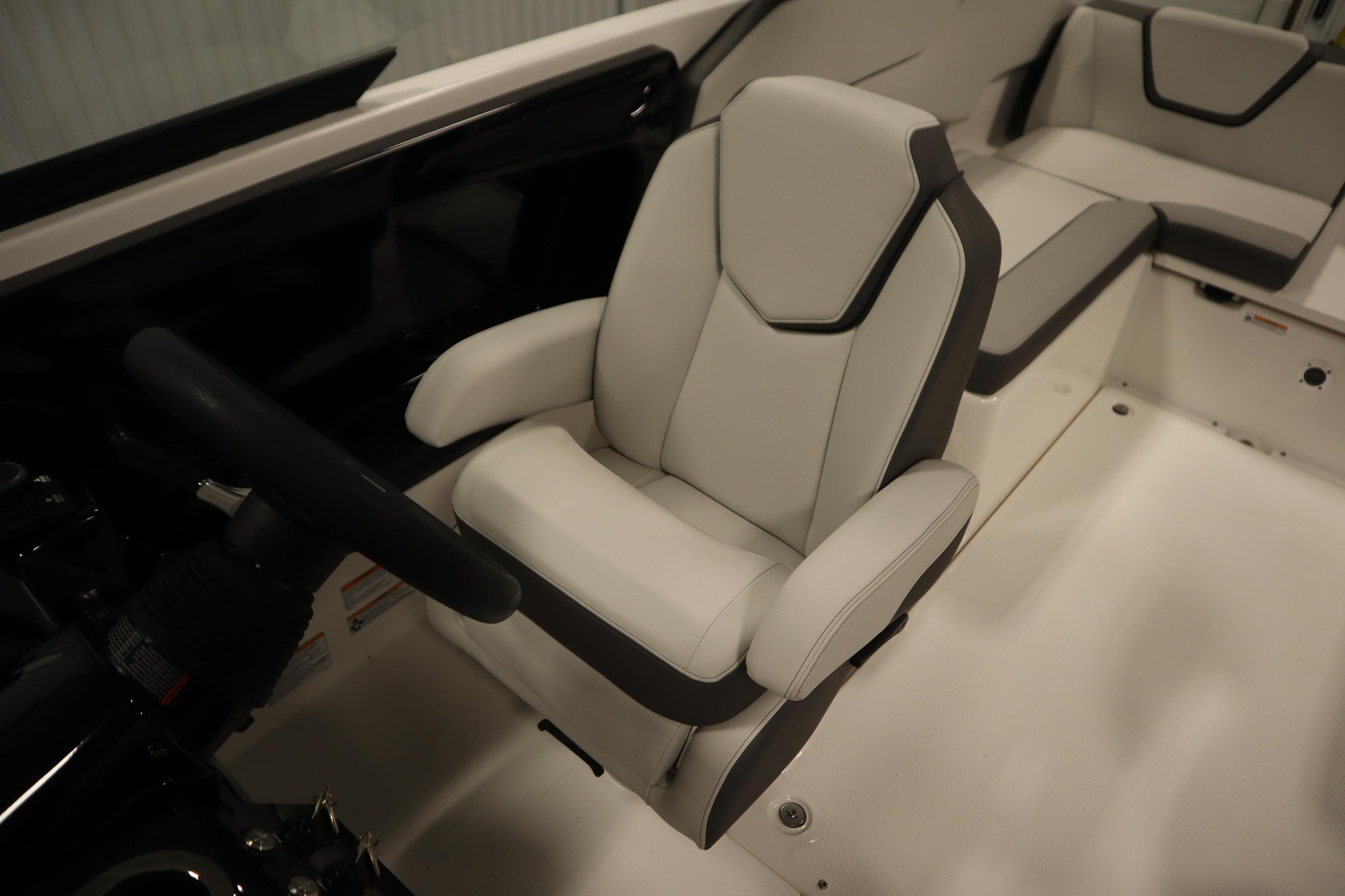 2026 Yamaha Boats AR250 interior with sleek, modern seating and steering wheel.