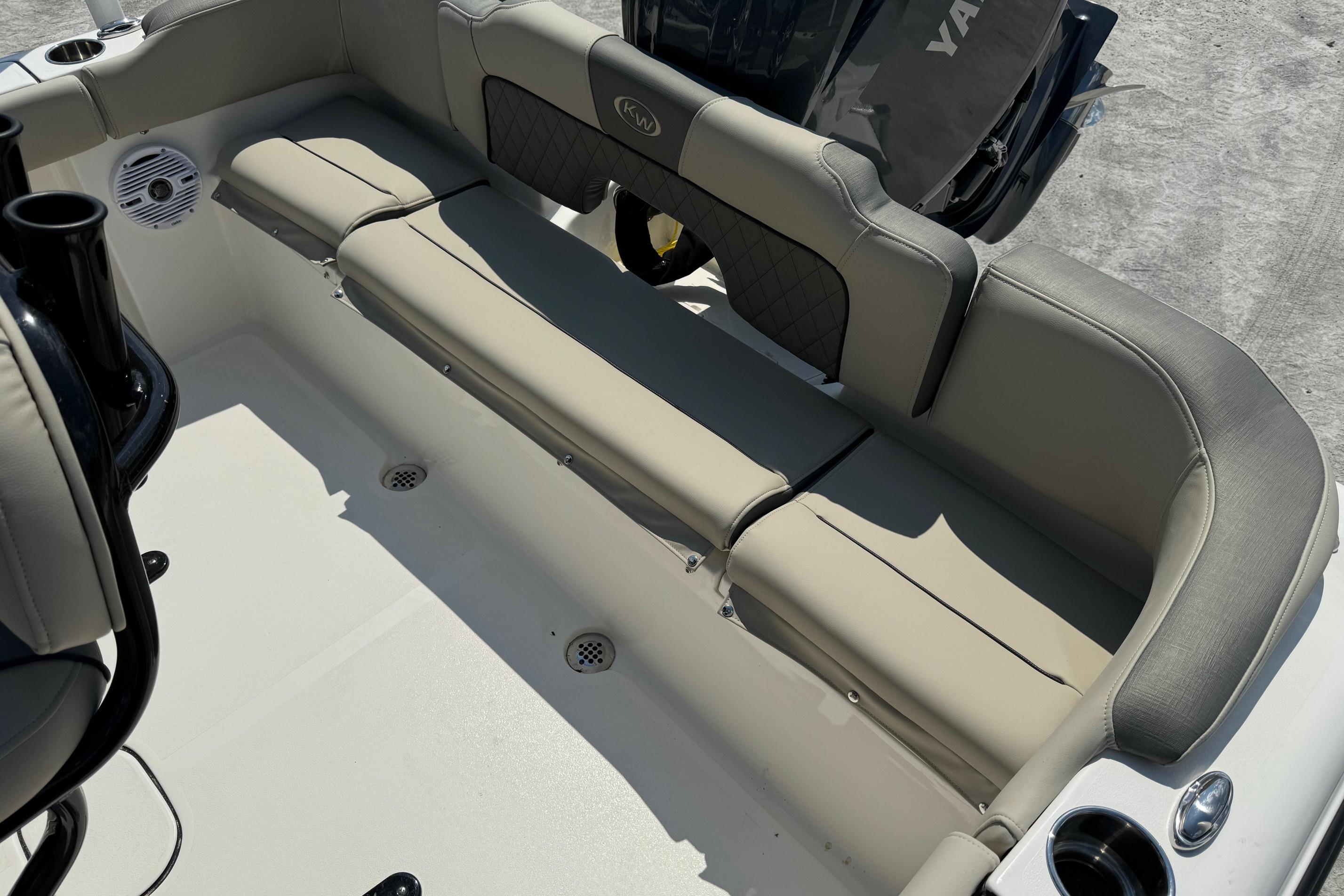 2025 Key West 203 FS boat interior with cushioned seating and Yamaha engine.