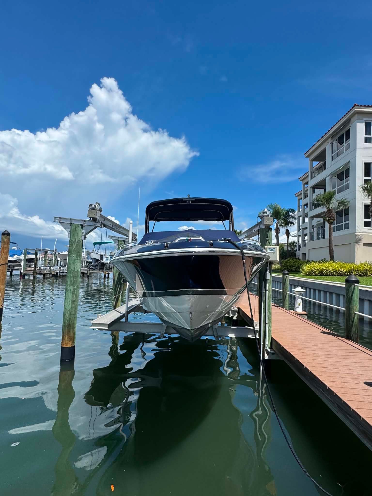 2018 Formula 270 Bowrider on a boat lift at the dock.