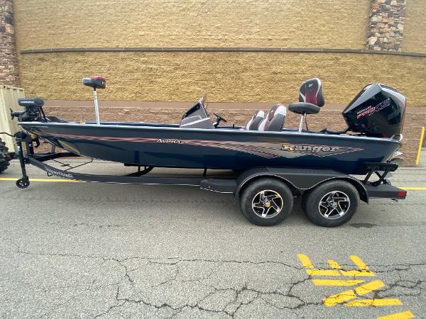 2025 Ranger ALPHA 208 boat on trailer, side view, parked on street.