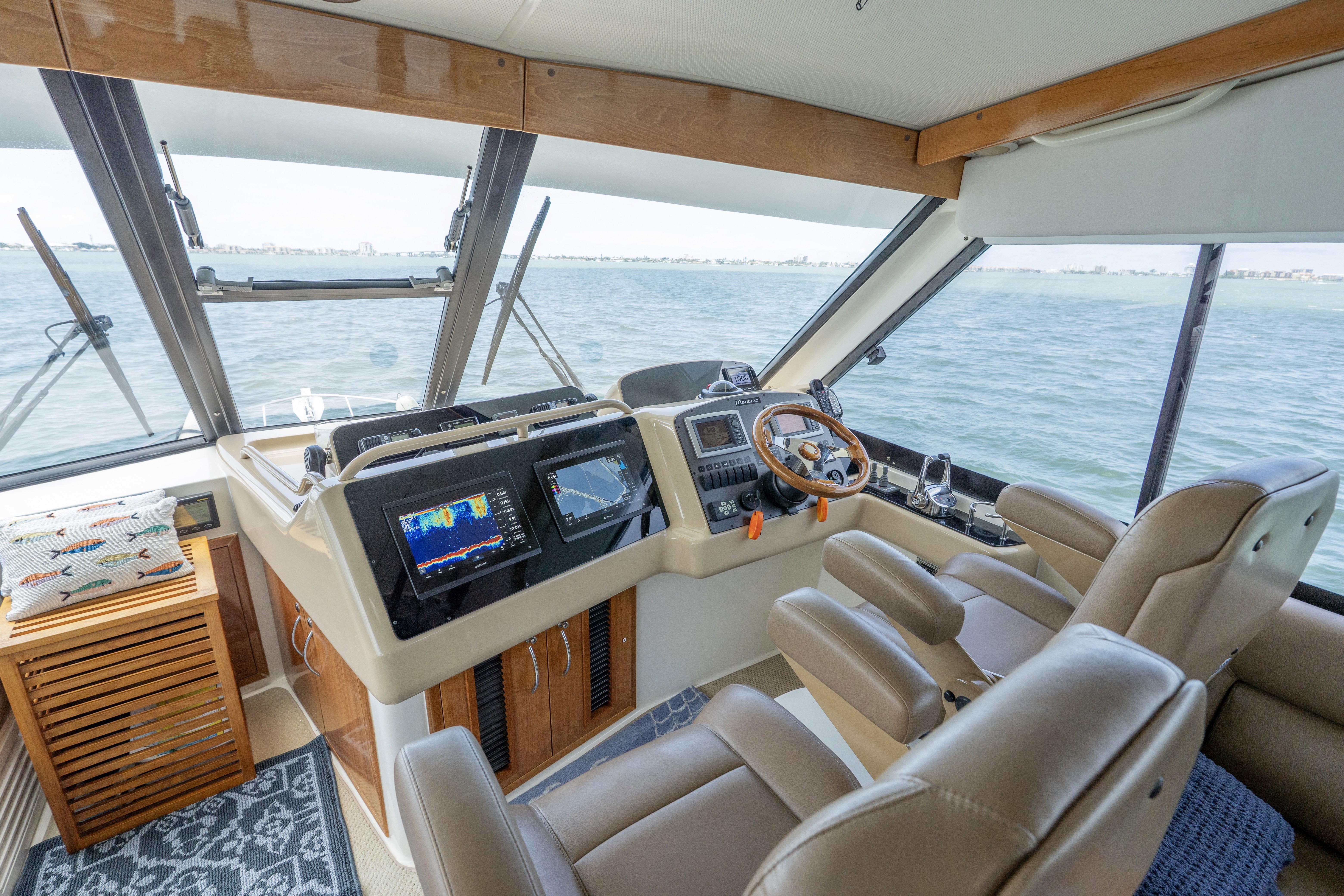Luxurious 2008 Maritimo 52 yacht helm with advanced navigation systems and plush seating.