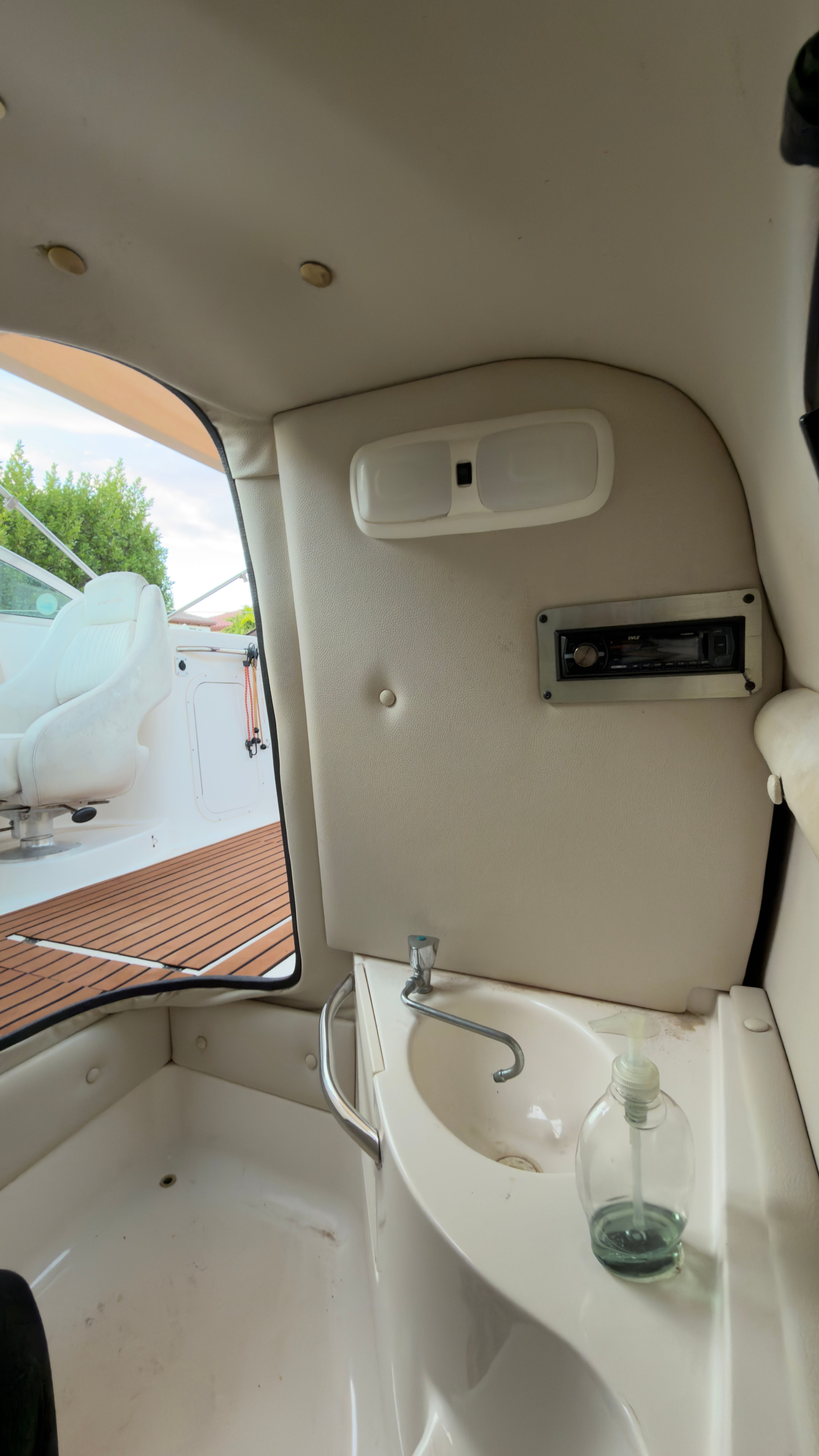 Interior of a 2003 Chaparral 263 Sunesta Deckboat with sink.