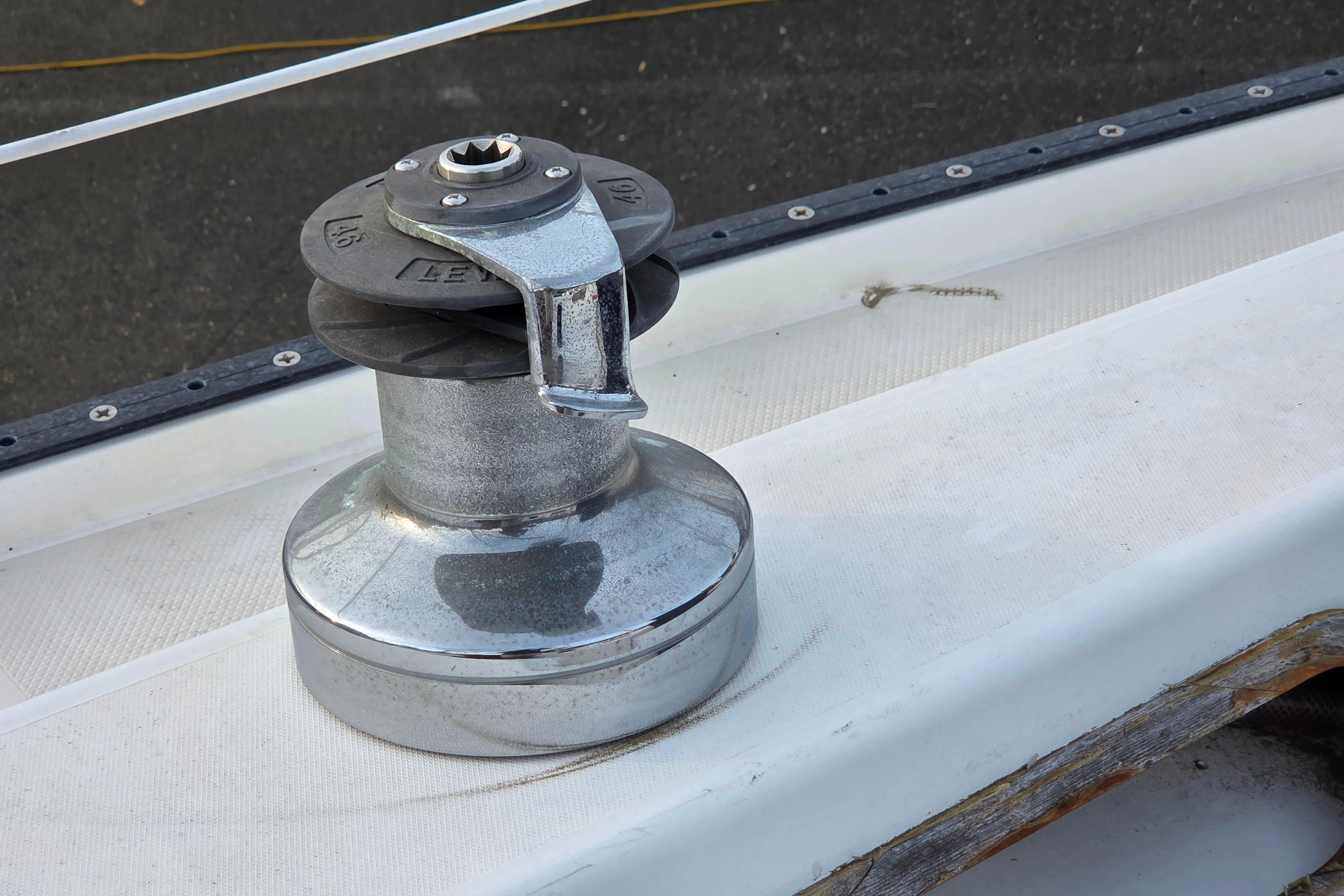 Chrome winch on 1986 Catalina 355 sailboat deck, close-up view.