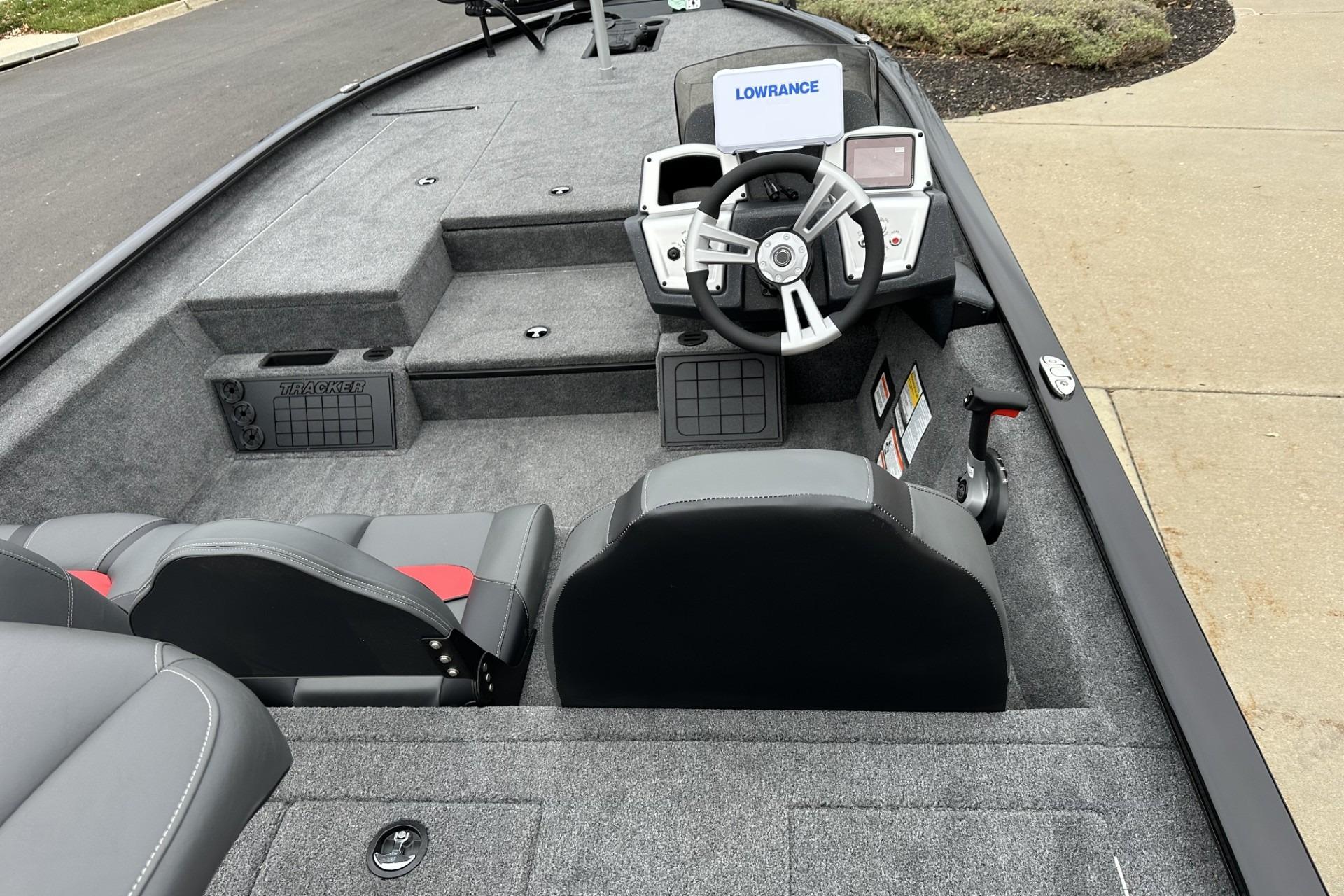 2025 Tracker Savage 215 boat interior with steering wheel and seating.