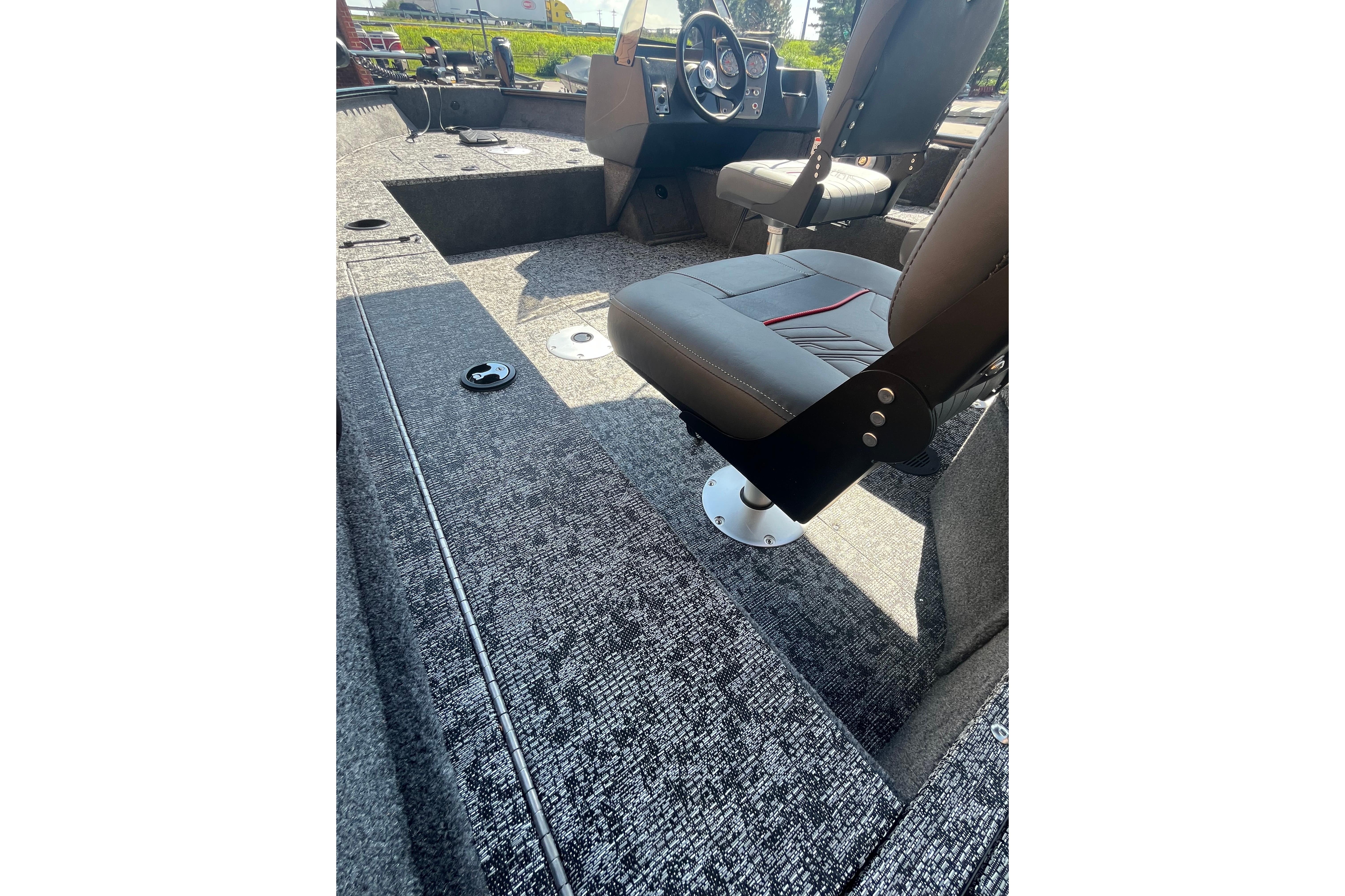 2026 Tracker Pro Guide V-16 SC boat interior with seating and steering console.