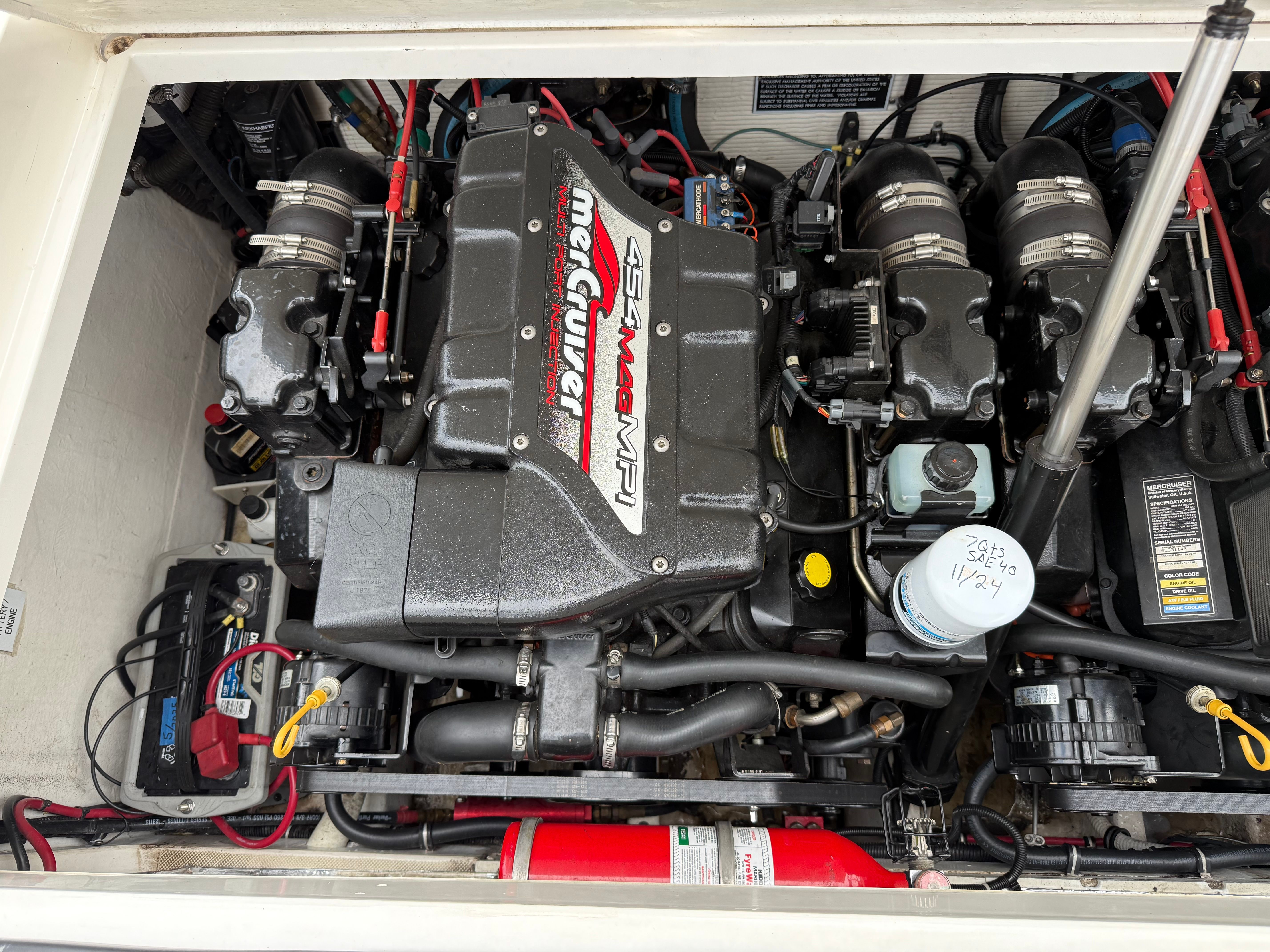 Engine compartment of a 1999 Fountain 32 Sport Fish Cruiser boat.