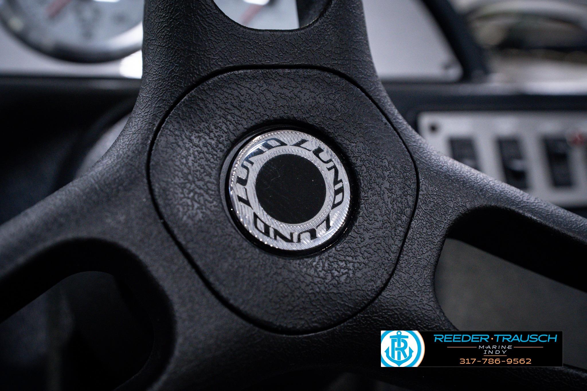 Close-up of 2026 Lund 1600 Fury SS steering wheel with logo.