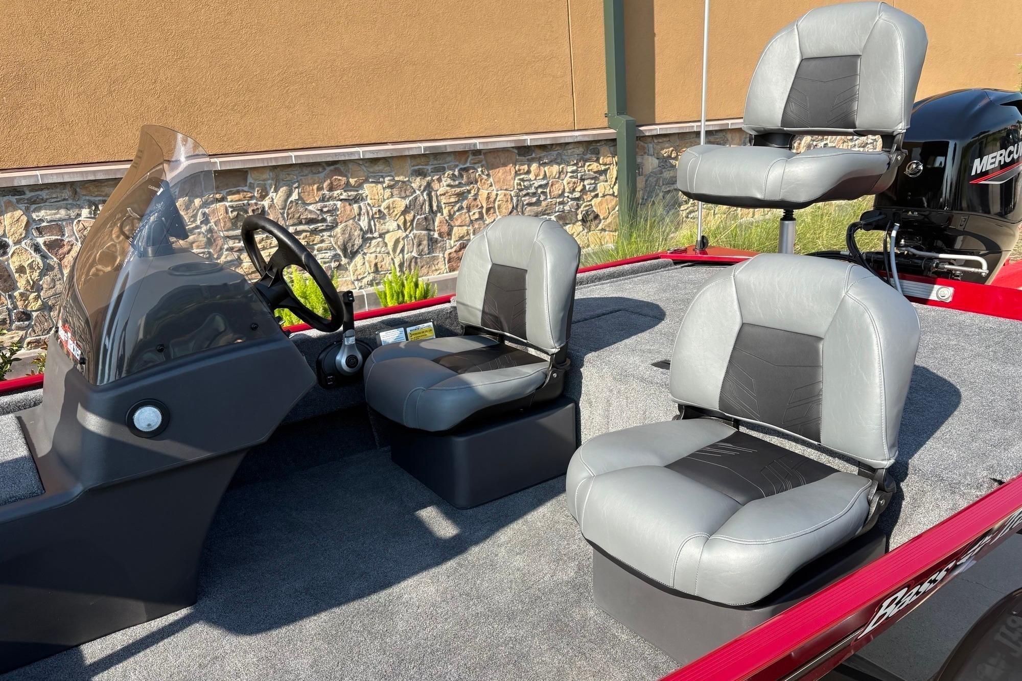 2026 Tracker Bass Tracker Classic XL boat interior with three gray seats and steering console.