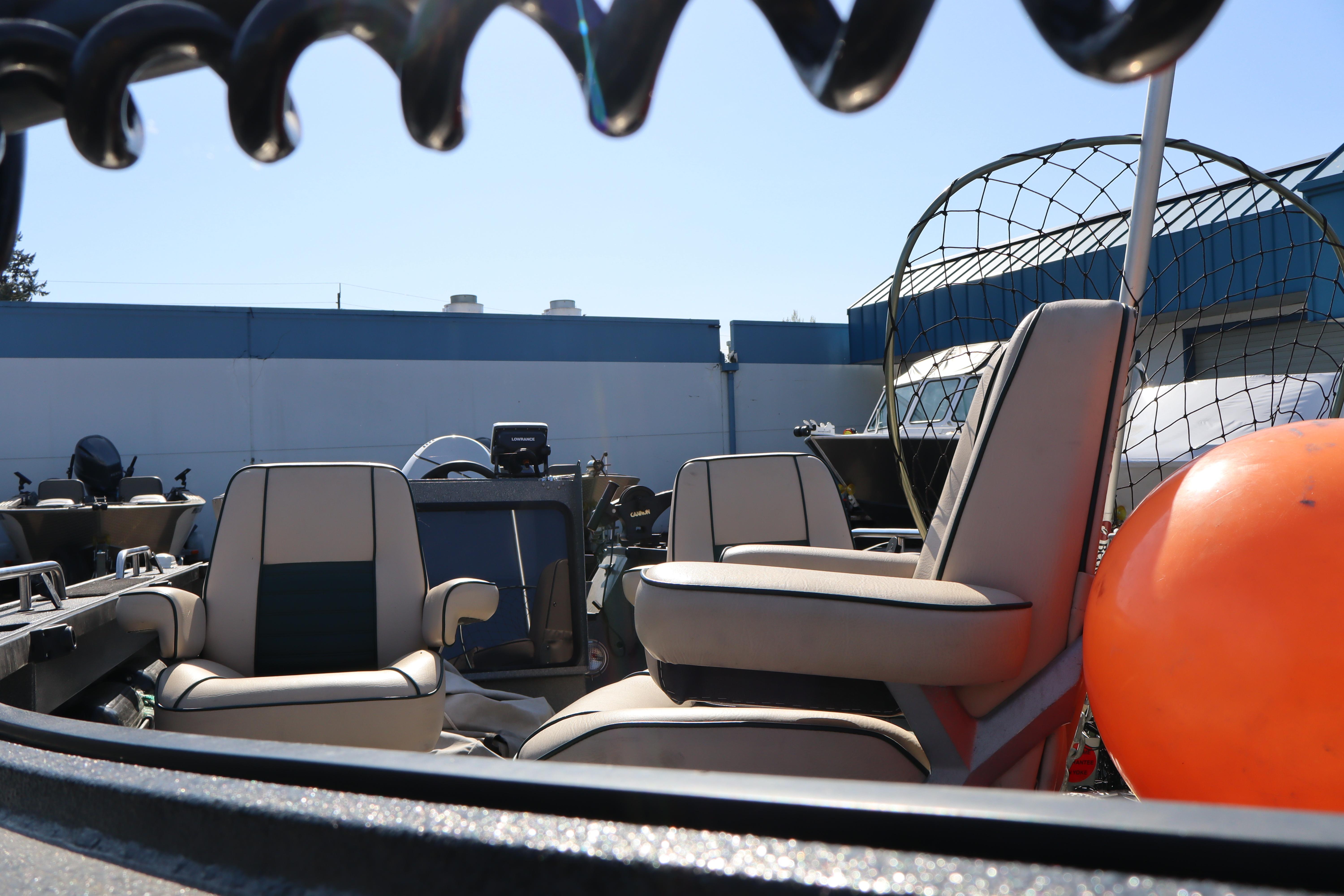 1997 Willie Boats Predator interior with seating and equipment, featuring a bright orange buoy.