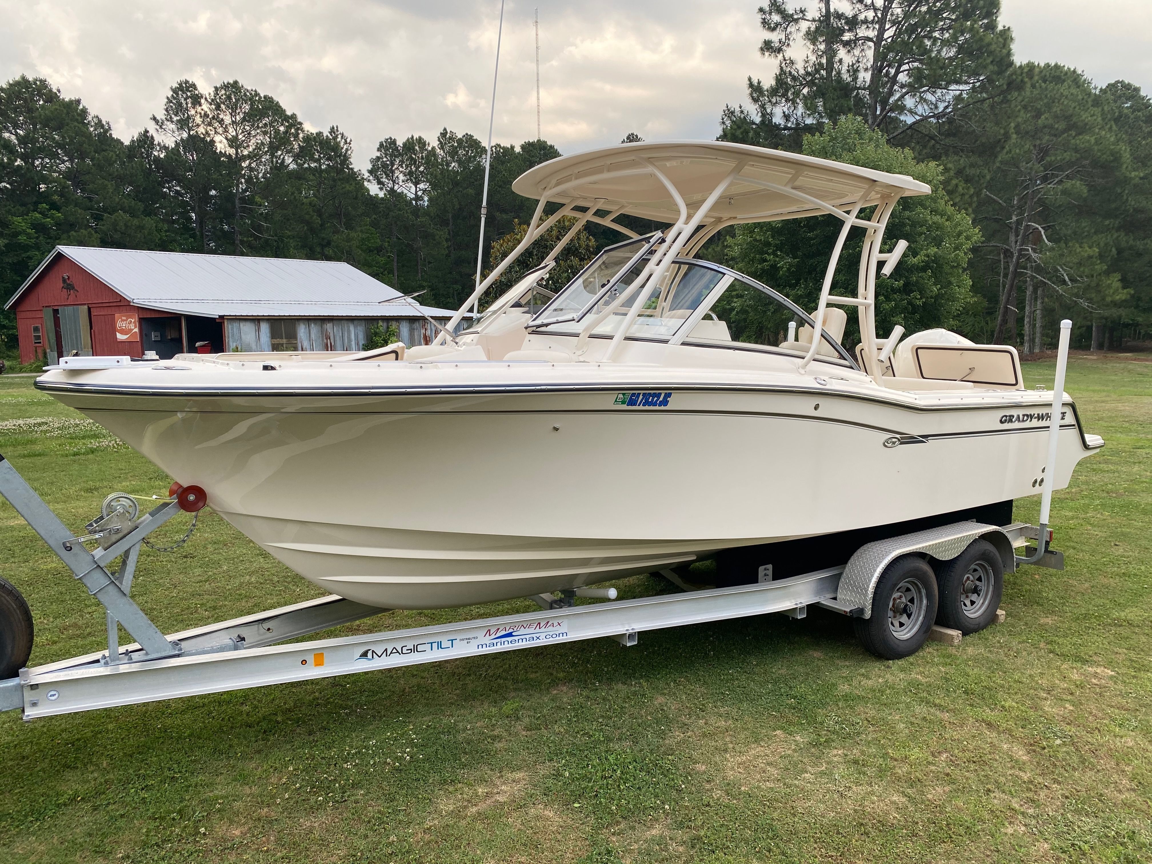 2018 Grady-White Freedom 235 boat on trailer outdoors.