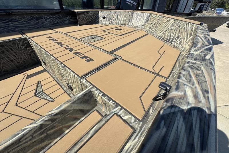 2026 Tracker Grizzly 1756 T Marsh boat with camo design and spacious deck layout.