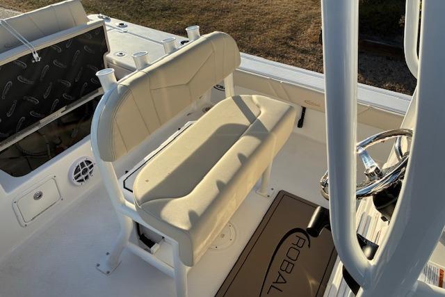 Interior of 2026 Robalo 226 Cayman with beige seat and steering console.