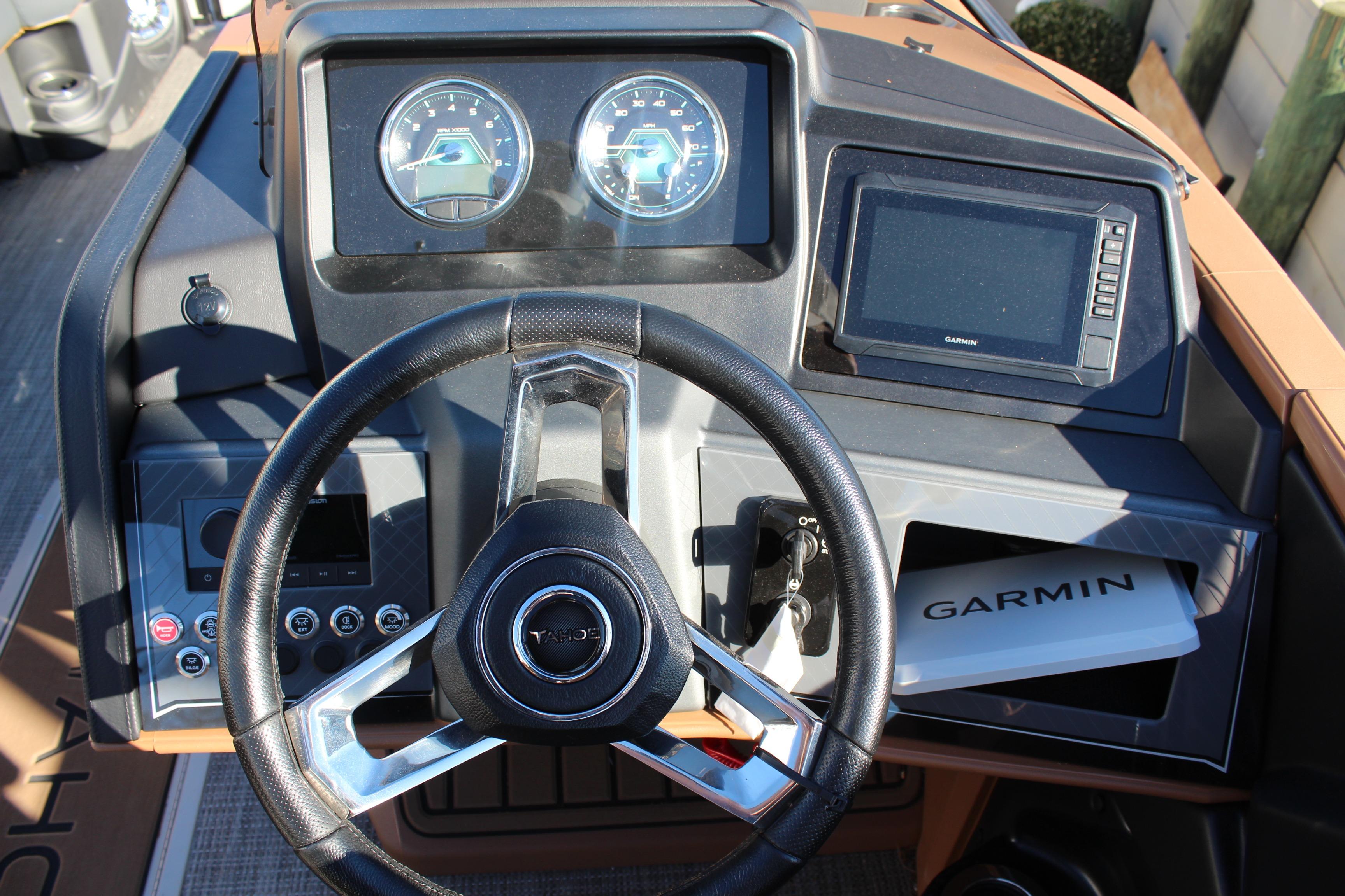 Steering console of 2026 Tahoe Pontoon Cascade Versatile Rear Bench with Garmin display.