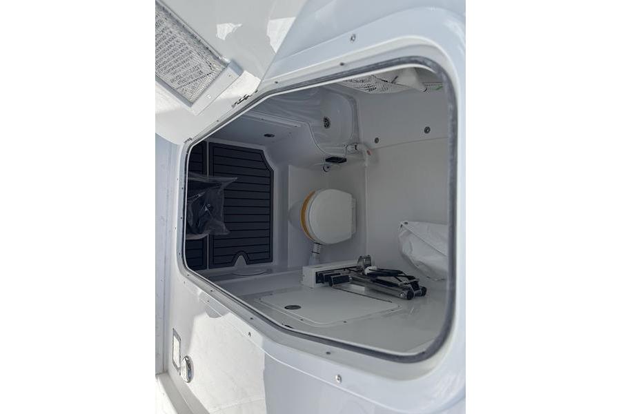 2026 Sea Hunt Gamefish 30 Forward Seating boat interior storage compartment.