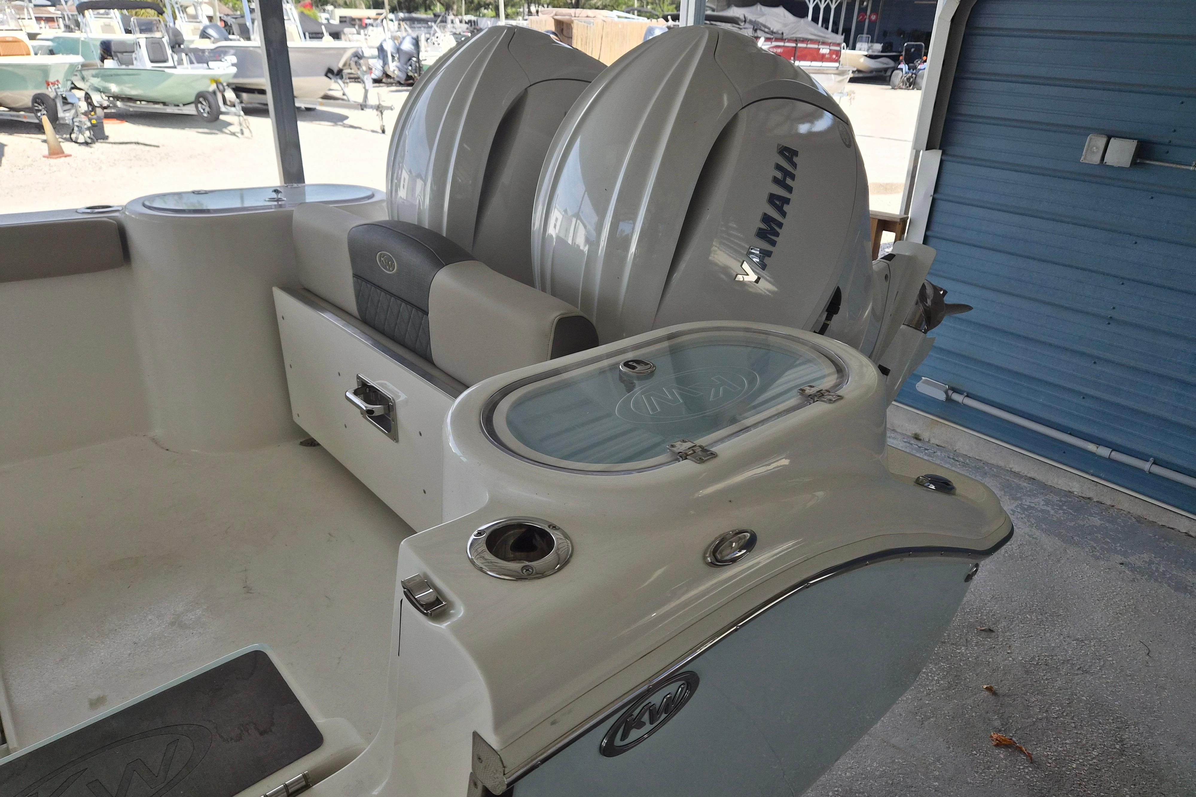 2026 Key West 260 Center Console boat with Yamaha engines in a showroom.