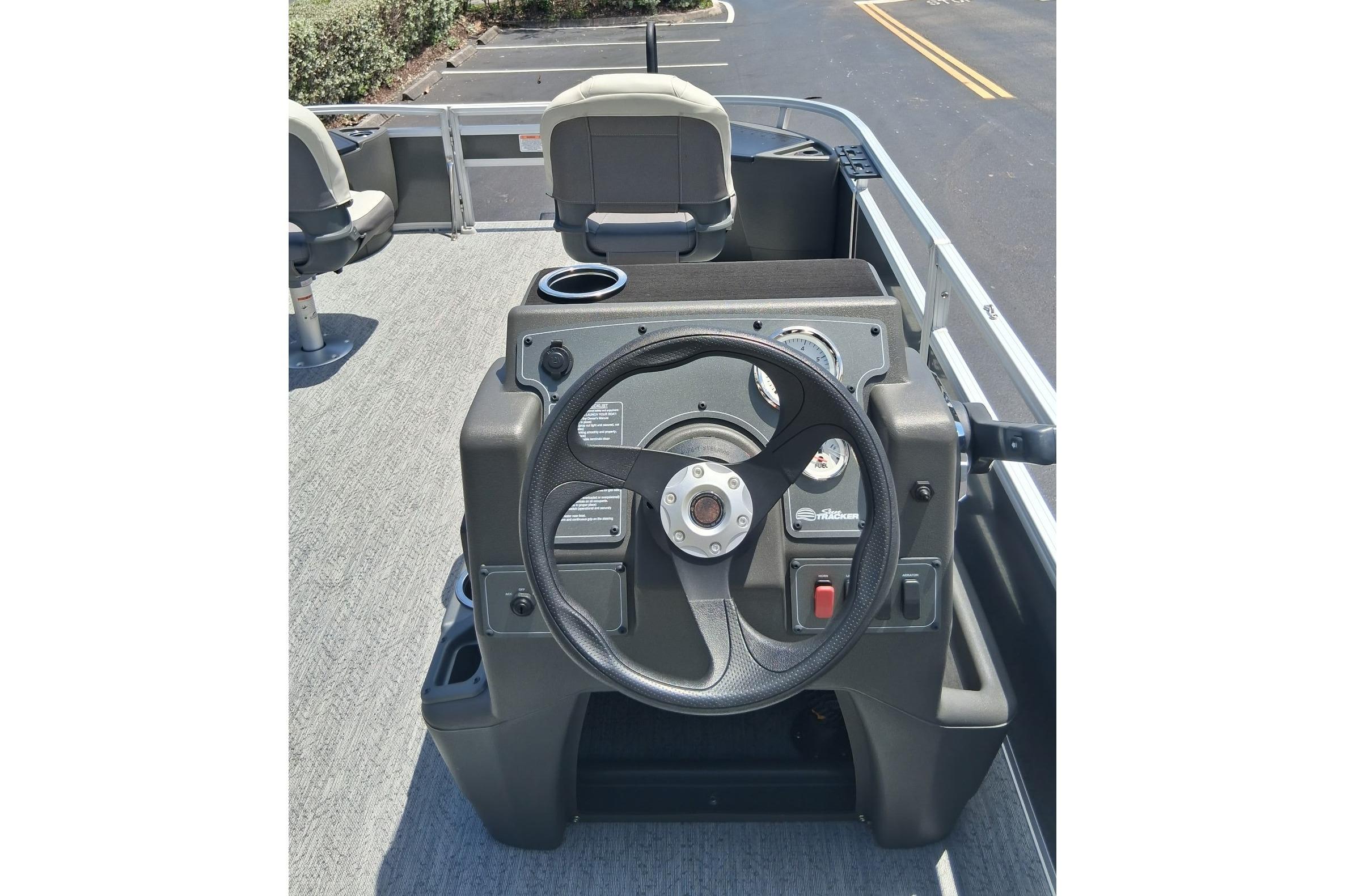 2026 Sun Tracker Bass Buggy 18 DLX steering console with modern controls and seating.