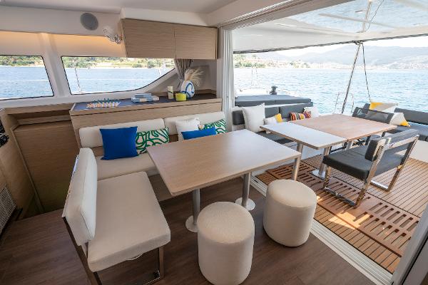 Luxurious interior of 2025 Lagoon 43 yacht with modern seating and ocean view.