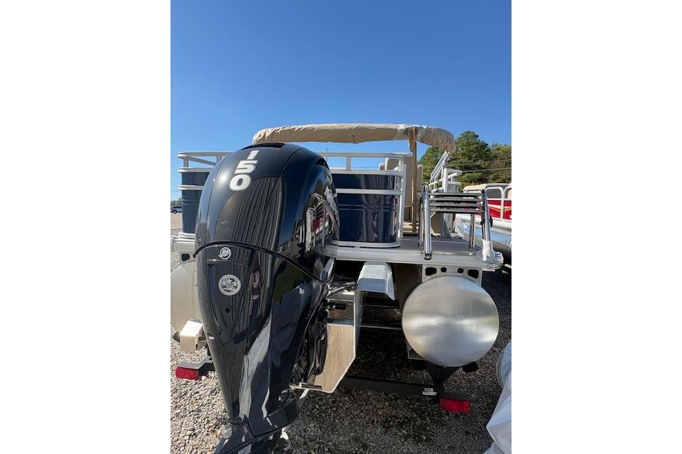 2025 Sun Tracker Fishin' Barge 22 XP3 with powerful outboard motor, rear view.