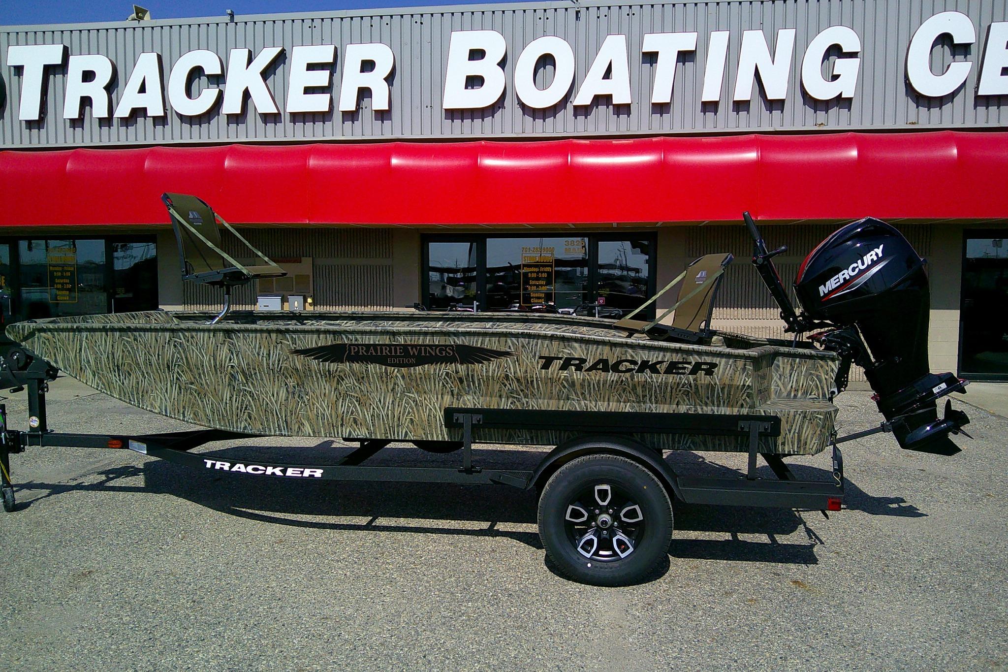 2026 Tracker Grizzly 1650 T Prairie Wings Edition boat at dealership, featuring camo design.