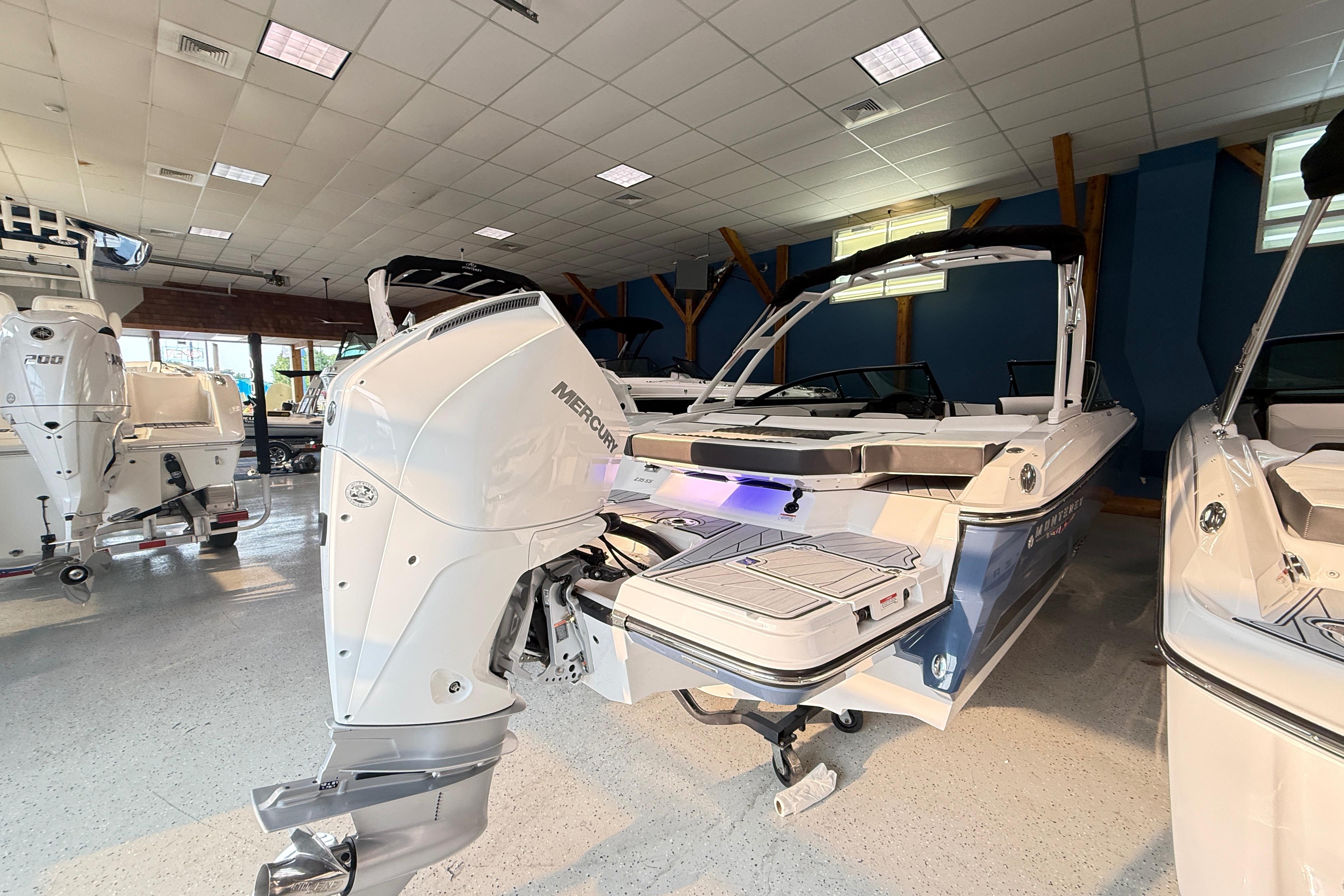 2025 Monterey 235SS Super Sport boat with Mercury engine in showroom.