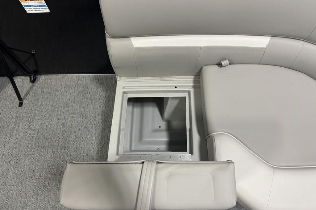 Storage compartment in 2026 Godfrey Xperience 2086 SFLX boat, featuring sleek seating design.